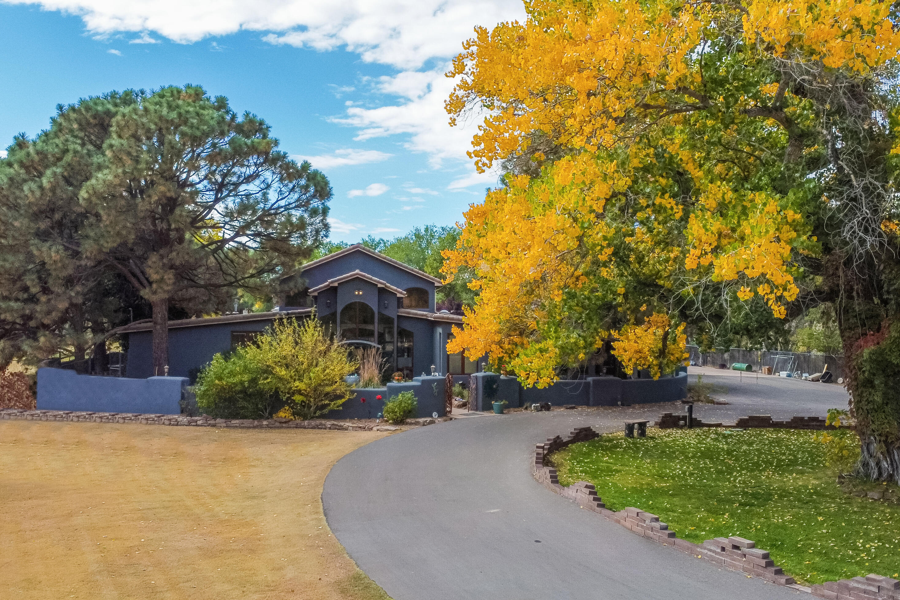 Come take a look at this exquisite North Valley home! Settled in on just under 4 acres this home boasts privacy and seclusion backing up right next to the Bosque. Complete with 5 Bedrooms, 6 bathrooms, and plenty of room to entertain this open floor plan has been meticulously designed to allow for whatever you have planned. A loft, an office, and even a secondary living space allows for you to adjust this home into whatever your heart desires. When you first walk in the high ceiling and beautiful architecture will take your breath away. Almost the whole right wing is the large primary suite with it's own outdoor patio space. Come check out this home soon situated under the beautiful cottonwoods the valley is so well known for.