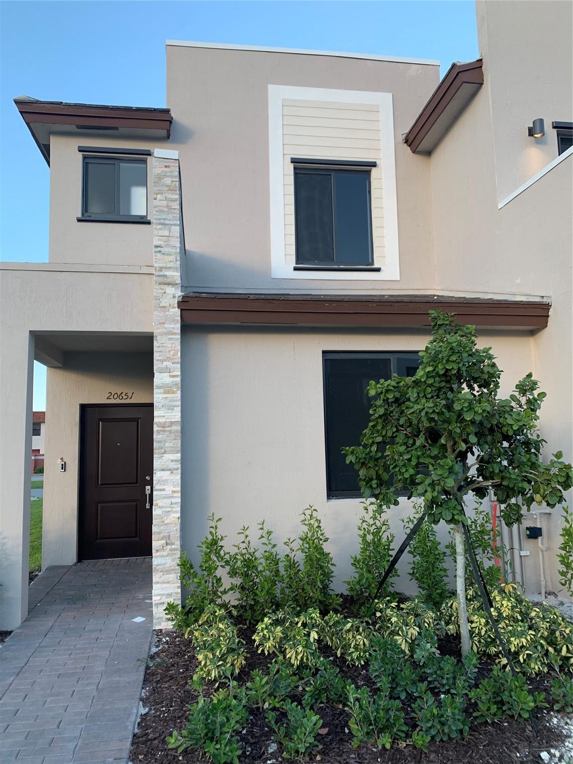 Exceptional corner lot 3-bed, 3-bath townhouse in the prestigious Via Ventura-Las Ramblas gated community, offering privacy and modern living. The first floor features a spacious open-concept design, seamlessly connecting the living, kitchen, and dining areas with direct patio access, and a bedroom and full bath provide convenience for guests or multi-generational living. Upstairs, two large bedrooms each boast an en-suite for ultimate comfort. Sunlight enhances the airy layout and private patio, perfect for relaxing or entertaining. Smart upgrades include a Ring doorbell, smart lock, and voice-assistant-ready thermostat. Enjoy two parking spaces and resort-style amenities: pool, gym, billiard room, BBQ area, and pet stations. Ideally located near I-95, shopping, dining, and Aventura Mall.