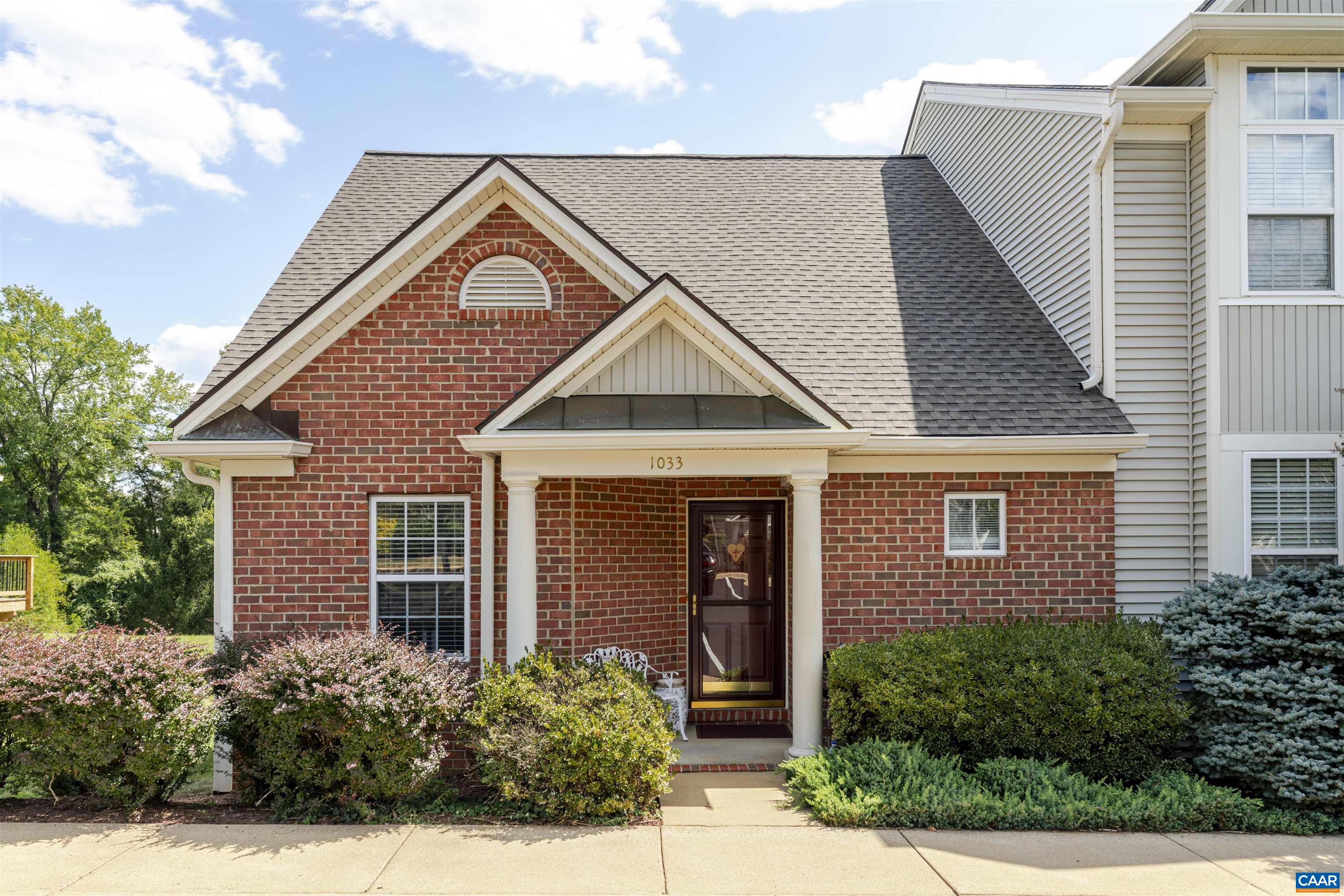Welcome to 1033 Somer Chase Ct, a beautifully maintained end-unit townhome in the Hollymead neighborhood. This 2-bed, 3-bath home offers approximately 1,900 sqft across two levels and the basement with a thoughtful layout, plenty of natural light, and vaulted ceilings.  The main floor features a kitchen with breakfast bar, dining area, living room with deck access, and an owner's suite for convenient one-level living. Upstairs you'll find a second bedroom with full bath ideal for guests or a home office. The partially finished basement includes a flexible living area with gas fireplace, full bath, ample storage, and opens to the rear yard and common area for outdoor living.  Modern upgrades and features include: - Whole-house Generac generator system - Level 2 EV charger - Two stair lifts for enhanced accessibility - Two assigned parking spaces  Located just minutes from Hollymead Town Center, offering quick access to shopping, dining, schools, and major roadways. This charming home combines comfort, convenience, and practical upgrades in one of Charlottesville’s most established communities. Don’t miss it! This home is ready to move into and enjoy.