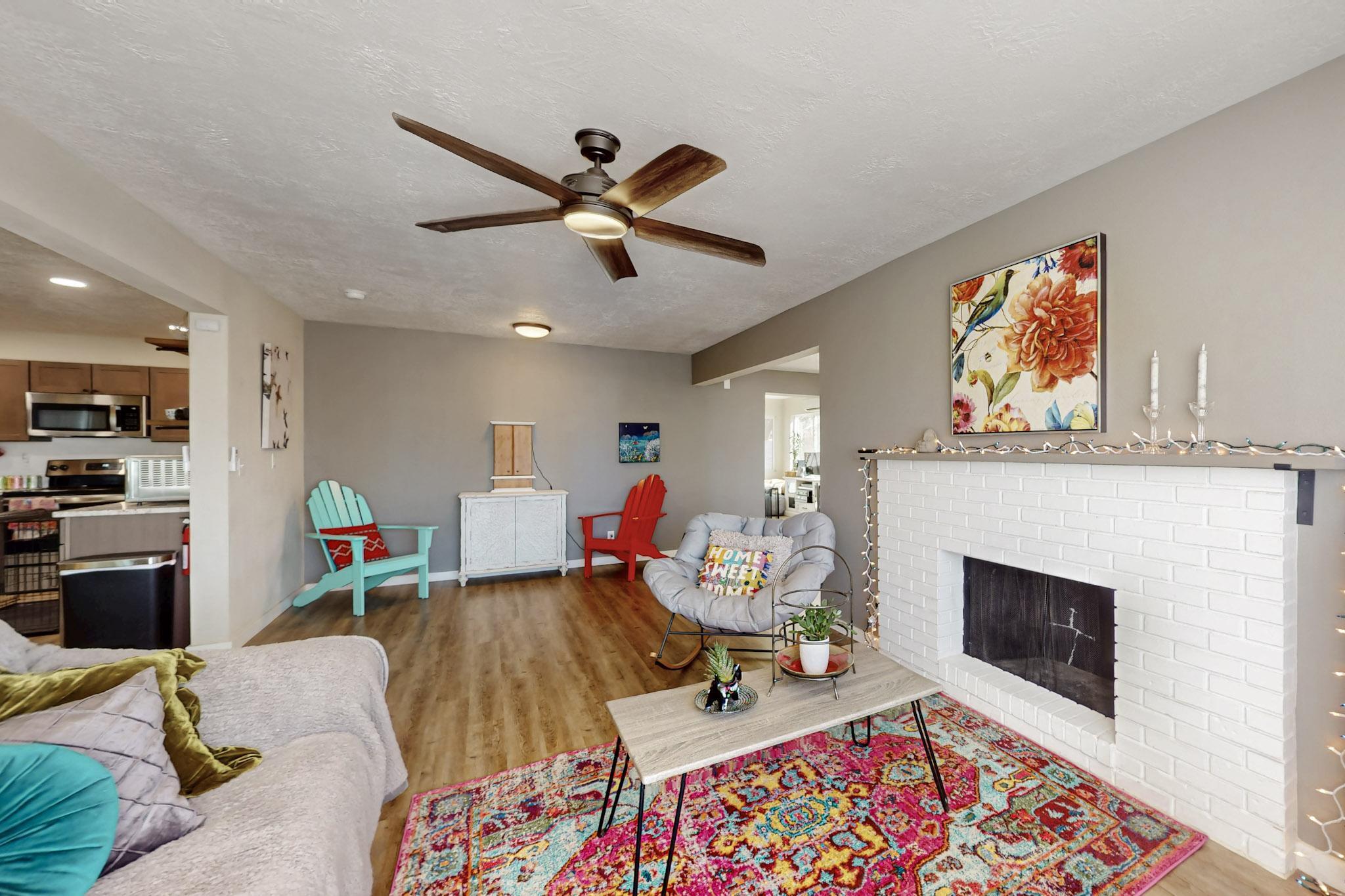 Discover this fully renovated 5-bedroom, 2-bath, 2,058 sq. ft. NE Heights home designed for comfort and savings. Powered by green solar energy with ~$3,500 annual savings and a mini split system for efficient heating and cooling, this home blends style with sustainability. Enjoy an airy, light-filled interior with laminate floors, new carpet, fresh paint, and modern finishes throughout. Features include a double garage, storage shed, cozy fireplace, and sunroom. Located on a corner lot close to shopping, dining, and parks--this move-in-ready gem offers both beauty and practicality.