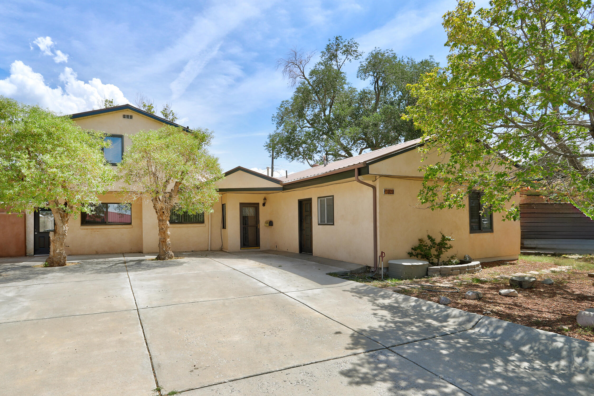 Welcome to your next home and investment opportunity! This unique property features two residences in one--a spacious 2,006 sq. ft. main home with 4 bedrooms and 2 baths, plus a 540 sq. ft. attached apartment, ideal for in-law quarters, guest space, or rental income, offset your monthly mortgage with $800 or more per month.The entire property has been tastefully updated with fresh paint, new flooring, and beautifully renovated bathrooms and kitchen. A bright bonus sunroom adds extra living space, perfect for morning coffee or unwinding on a peaceful New Mexico afternoon.Whether you're looking for a multi-generational living option, income potential, or a flexible layout, this property checks all the boxes. Live in one unit, rent the other, or enjoy the whole space for yourself