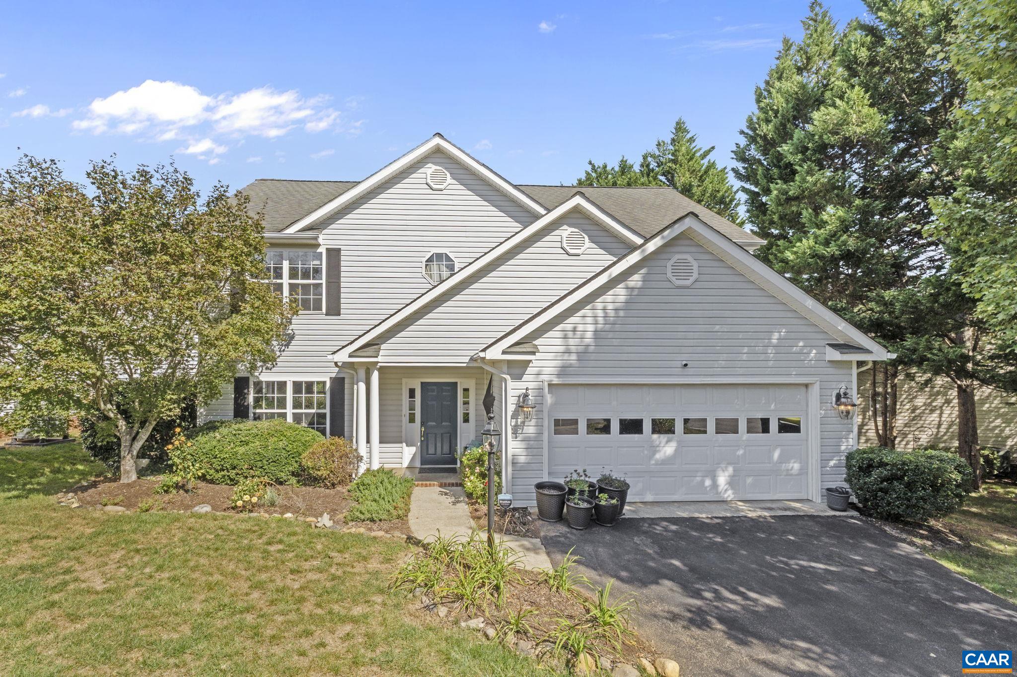 Fantastic offering in the sought-after Redfields neighborhood on a quiet street convenient to UVA, downtown, I-64, and 5th Street Station. The sunny main level features a recently updated kitchen with quartz countertops, two generous living spaces, a gas fireplace, and a dining room that overlooks the backyard. A stylish half bath completes the space. The highlights of the spacious primary suite on the 2nd level include a walk-in closet, a generous en suite bath with a soaking tub and walk-in shower, and a vaulted ceiling. Three additional bedrooms, a full bath, and a conveniently located laundry area round out the 2nd level. Everyday living is made easier with a zero-step entry from the 2-car garage and close access to neighborhood amenities. Outdoors, enjoy a large deck perfect for entertaining or relaxing, and a backyard ideal for play, gardening, or simply soaking up the sun. This move-in ready home combines modern updates, a great layout, and an unbeatable location—don’t miss it!