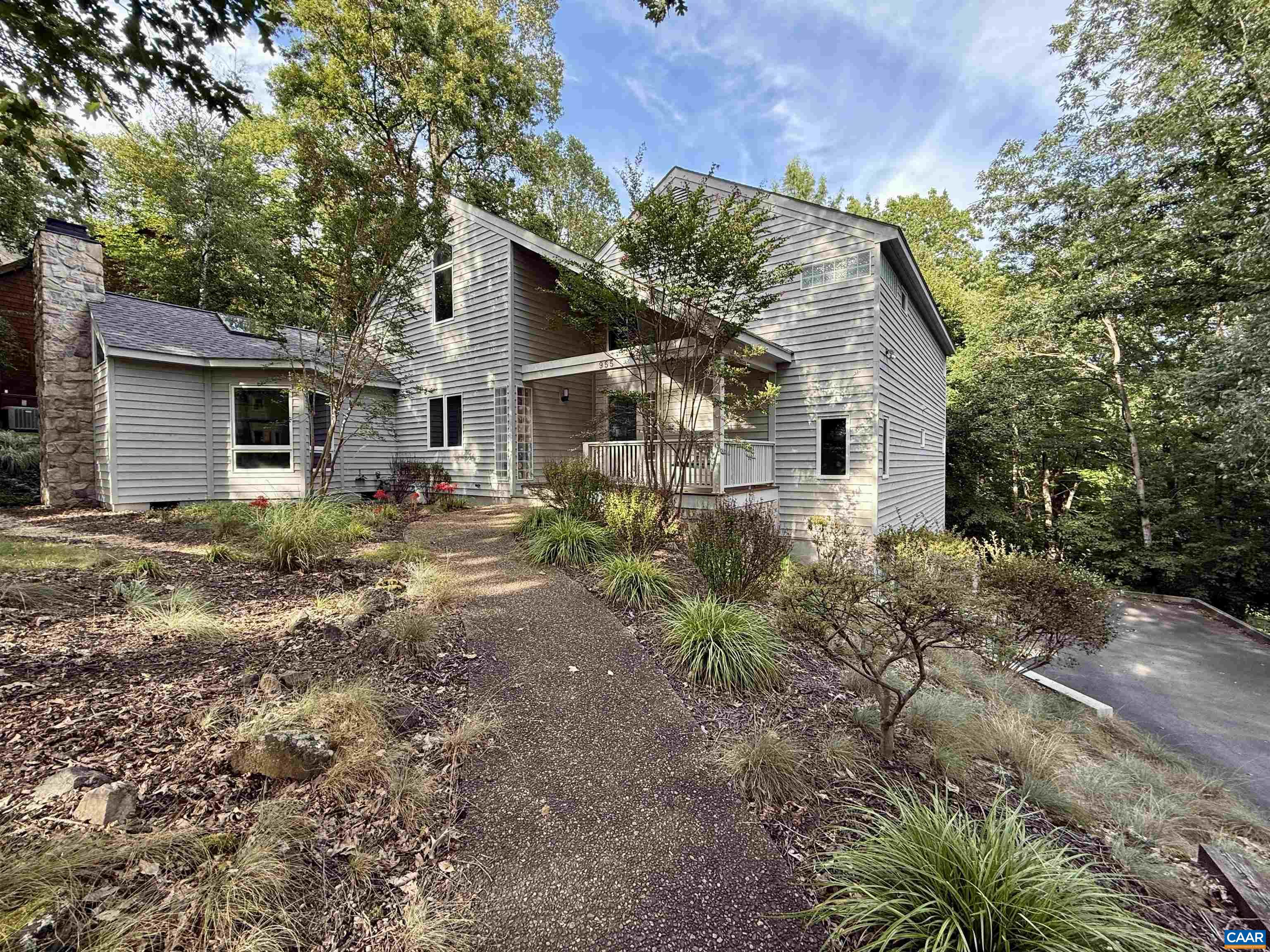 First time on the market! OPEN HOUSE Sunday 1-3.  Private “Tree house” views from nearly every window. Well built and meticulously maintained custom home.  Hardwood flooring milled from trees cleared from this lot. Floor to ceiling windows provide unmatched elevated and wooded views.  The home is full of natural light from custom windows to custom skylights through out the home. Rear screened porch and large rear open deck are perfect for decompression, relaxation and entertaining.  Large front covered porch as well with suspended swing over looking mature and landscaped front yard.  Above average size living spaces. Extra large garage with separate dedicated workshop space. Loads of storage areas in the terrace level.  This home is clean, well built and exceptionally well maintained. Outstanding location in desirable Dunlora neighborhood. Video and 3D tour links available by request. New carpet allowance is negotiable.