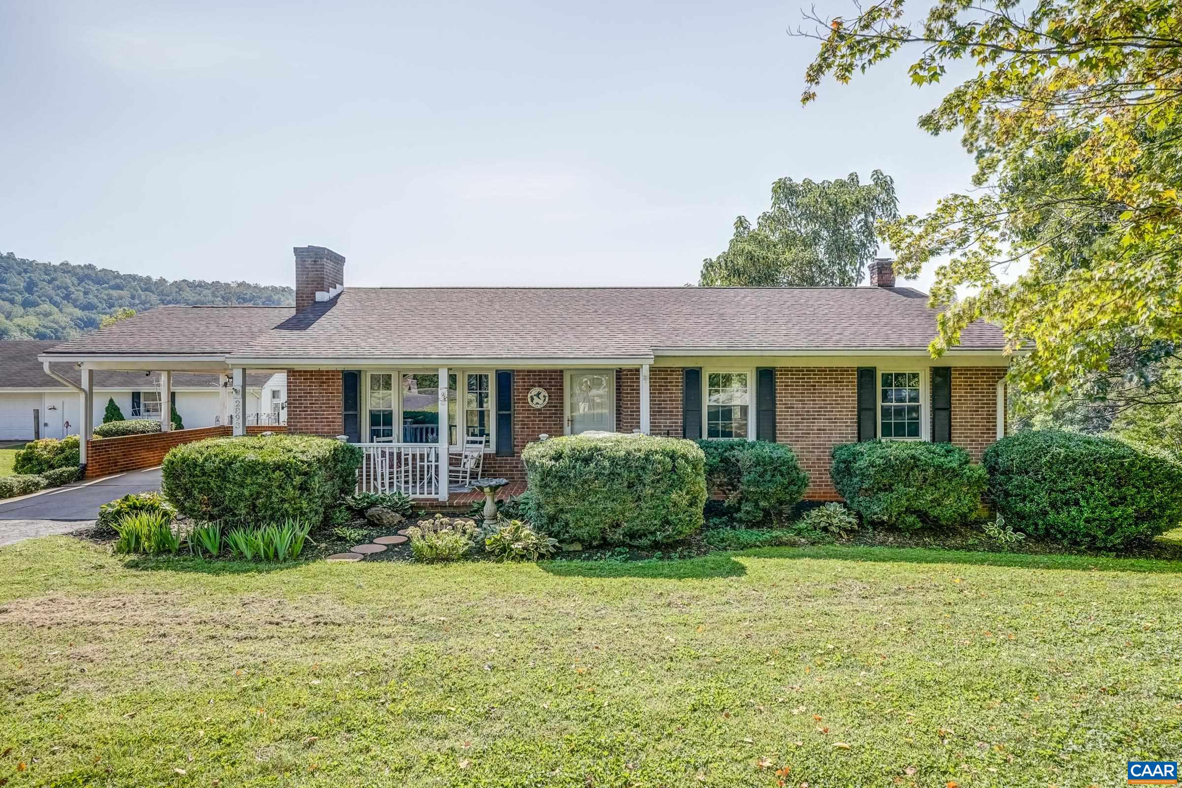 Open House Sun. 9/7 1-3. Welcome to "Serenity". A lovely FURNISHED mini-farm property minutes from all of Charlottesville's amenities. Have your morning coffee while gazing over the pastures and mountains beyond. This ranch offers 3+ bedrooms with a fabulous lower (walk-out) level, offering a second kitchen, family room, full bath and breakfast/sunroom. Perfect space for the in-laws, teens or AirBNB business. Extensive patios and entertainment areas complete with pizza stove, fire pit, jacuzzi and outdoor prep. area. The massive 2100 sq ft. detached garage was designed with oversized parking for the vehicles as well as a stupendous workshop. 30 amp service on the concrete pad for an R.V. There is a step down level to the garage that features an area for farm animals or additional storage. This well located home would be perfect for a home based business, in fact, it was a highly successful daycare/preschool in the past.