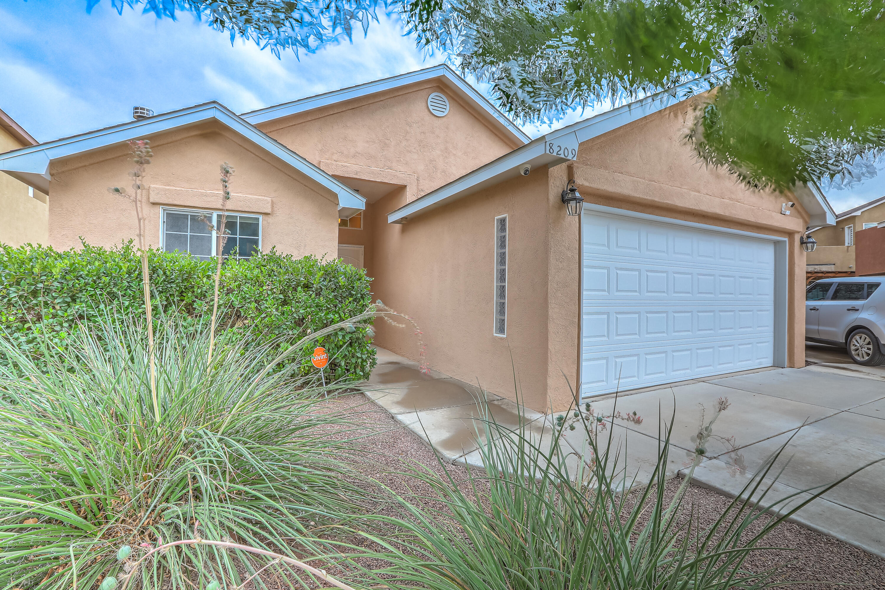 Discover this charming, well maintained single-story home, situated on a generous lot with backyard access The open floorplan blends an inviting eat-in kitchen, a dedicated dining area, and a spacious living room with a cozy fireplace--ideal for both everyday living and entertaining. These features combine to create the perfect spaces for relaxation and entertaining. Large windows fill the interiors with natural light, enhancing the warm ambiance throughout. The property provides easy access to essential amenities, Tower Pond Park is a short distance away and UNM and the ABQ International Sunport are approximately 20 minutes away. The expansive backyard serves as a tranquil retreat, showcasing mature fruit trees and a lush lawn, perfect for outdoor activities or peaceful moments.