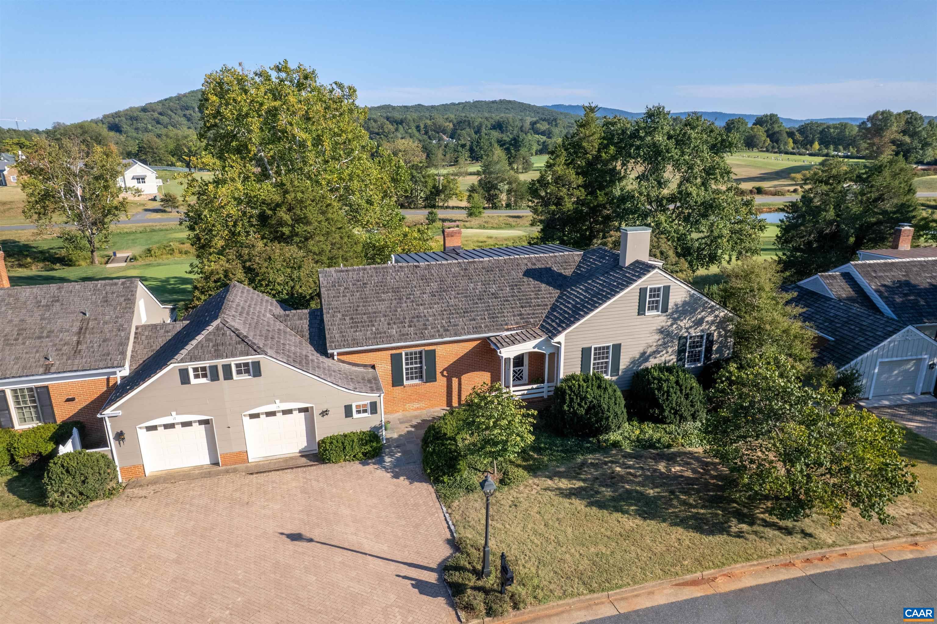 Light-filled home with spectacular views of the UVA Golf Course and Ragged Mountains. The open-concept floor plan includes a first-floor primary suite, spacious eat-in kitchen, library, custom Gaston & Wyatt millwork, built-ins, and a sunroom designed to capture natural light throughout the day. Additional features include hardwood floors throughout, a whole-house generator, one-car garage, and a large back patio overlooking the golf course. The level backyard is ideal for entertaining, while the home’s location offers unmatched convenience. Just moments from Boar’s Head Sports Club, UVA, Downtown, and all Charlottesville has to offer.