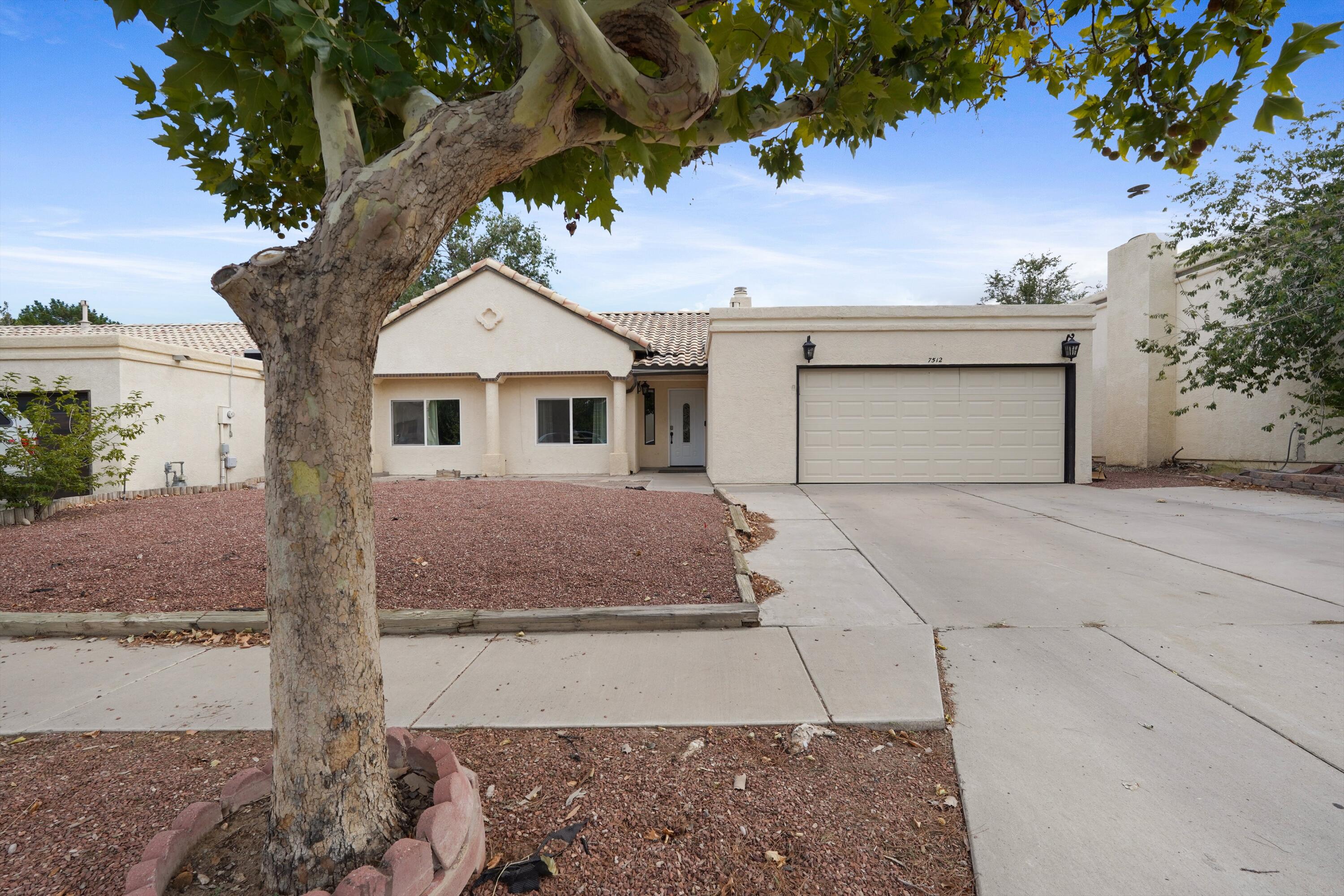 Check out his 3BD, 2 BA, home with an open floor plan offers a functional and inviting living space. As you walk in there is a gas fire place placed in a stone work wall. Opens up to the dining room and kitchen. The kitchen is equipped with stainless steel appliances and gas stove. Two bedrooms and one primary suite with two full bathrooms. The back yard has a covered patio, perfecting for entertaining family and guests. Landscaped backyard with grass and sprinkler system. Home has been upgraded to refrigerated air. With a 2 car garage.