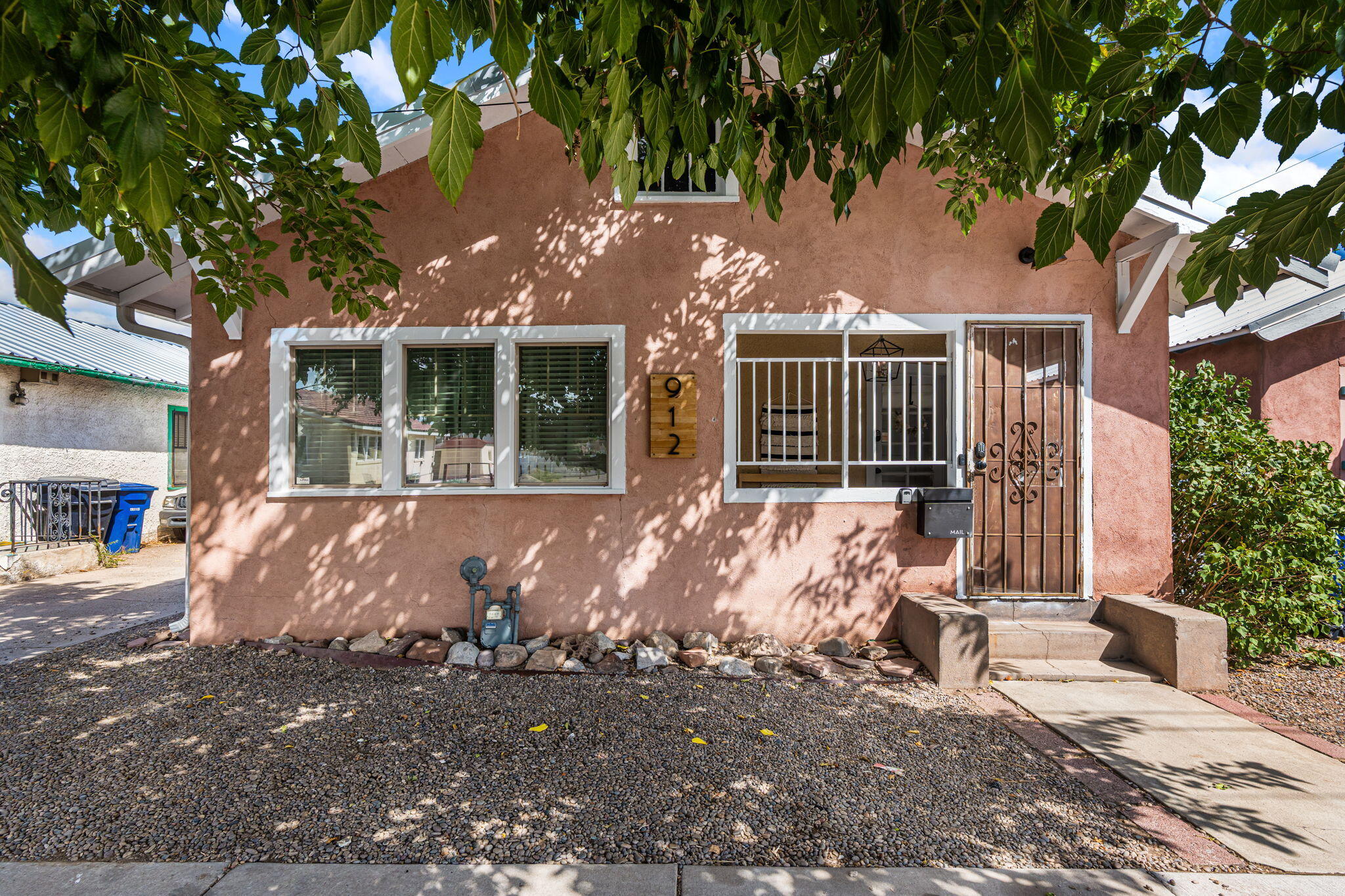 Welcome to your adorable new home in the heart of downtown Albuquerque! This cozy bungalow offers the perfect mix of charm, comfort, and convenience. Just steps from the city's growing restaurant scene, local coffee shops, and the popular Growers' Market, you'll love the neighborhood's walkable lifestyle. Ideally located near the judicial district and revitalized Wells Park, this home is perfect for professionals or creatives. Inside, you'll find bright, inviting spaces, original details, and thoughtful updates. Outside is a private yard, great for entertaining. Don't miss the opportunity to own two fully furnished Airbnbs next door to each other! Zoned mixed use, it's a rare chance for income, live/work space, or a flexible multi-unit setup. A unique opportunity in the heart of the city.