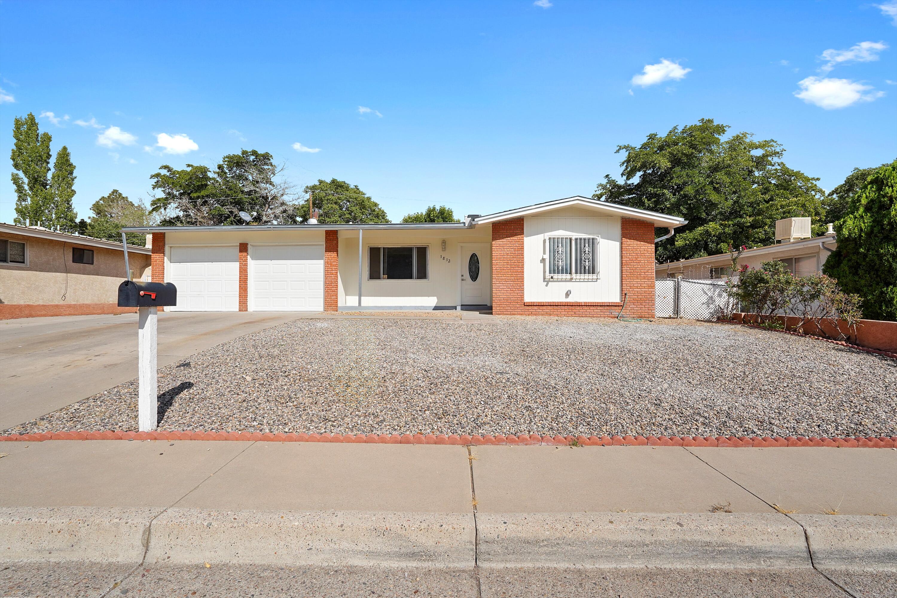 Beautifully renovated home in the NE Heights.  This home sits on a street with no through traffic, and just underwent numerous updates.  New modern kitchen with Stainless Steel appliances & granite counters.  All new LVP flooring throughout, both baths updated with new shower tile, vanities, fixtures and toilets.  New recessed lighting, freshly painted, tiled fireplace, and brand new AC just installed too.  Spacious floorplan features two living areas, dining space, and a bonus room in the back - perfect for a workout space, home office, or kids play area. Backyard access on the north side of the home.  This one is clean and move in ready.