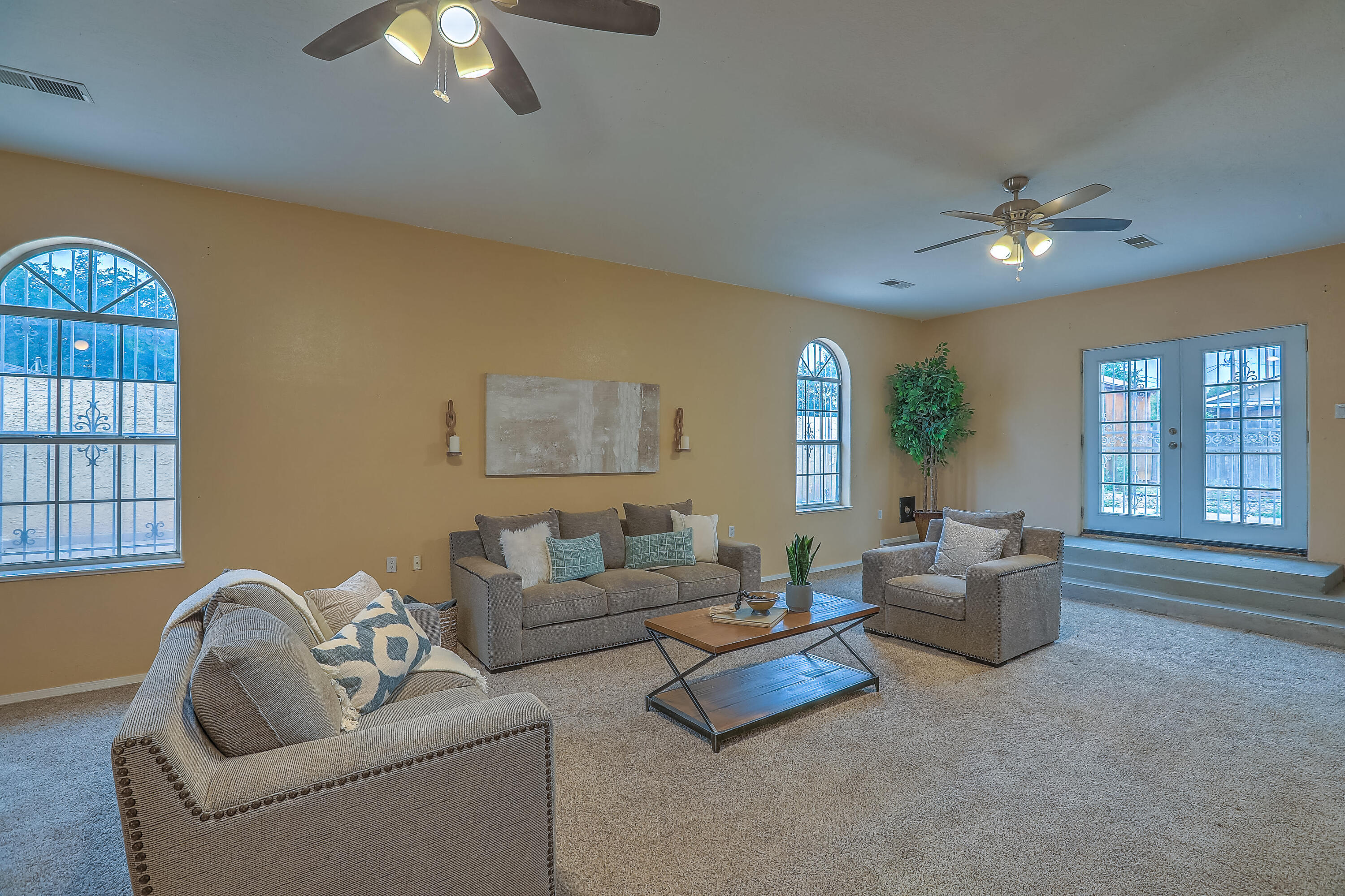 Get ready to fall in love with this North Valley gem, perfectly situated near restaurants and shopping with easy access to I-25! This beautiful home offers the ideal blend of comfort, convenience and character. As soon as you step inside, you'll discover the heart of the home - a versatile living space that can host lively game nights, movie marathons or quiet evenings curled up on the couch.  The primary bedroom is a huge dreamy retreat with an oversized walk-in closet for all of clothes and accessories. Two additional bedrooms sharing a large bathroom with a cozy fireplace the perfect set up for family, guests or even a home office. The backyard features a fire pit and endless possibilities - whether you want a garden, play area or a relaxing hammock to watch the vibrant NM sunsets.