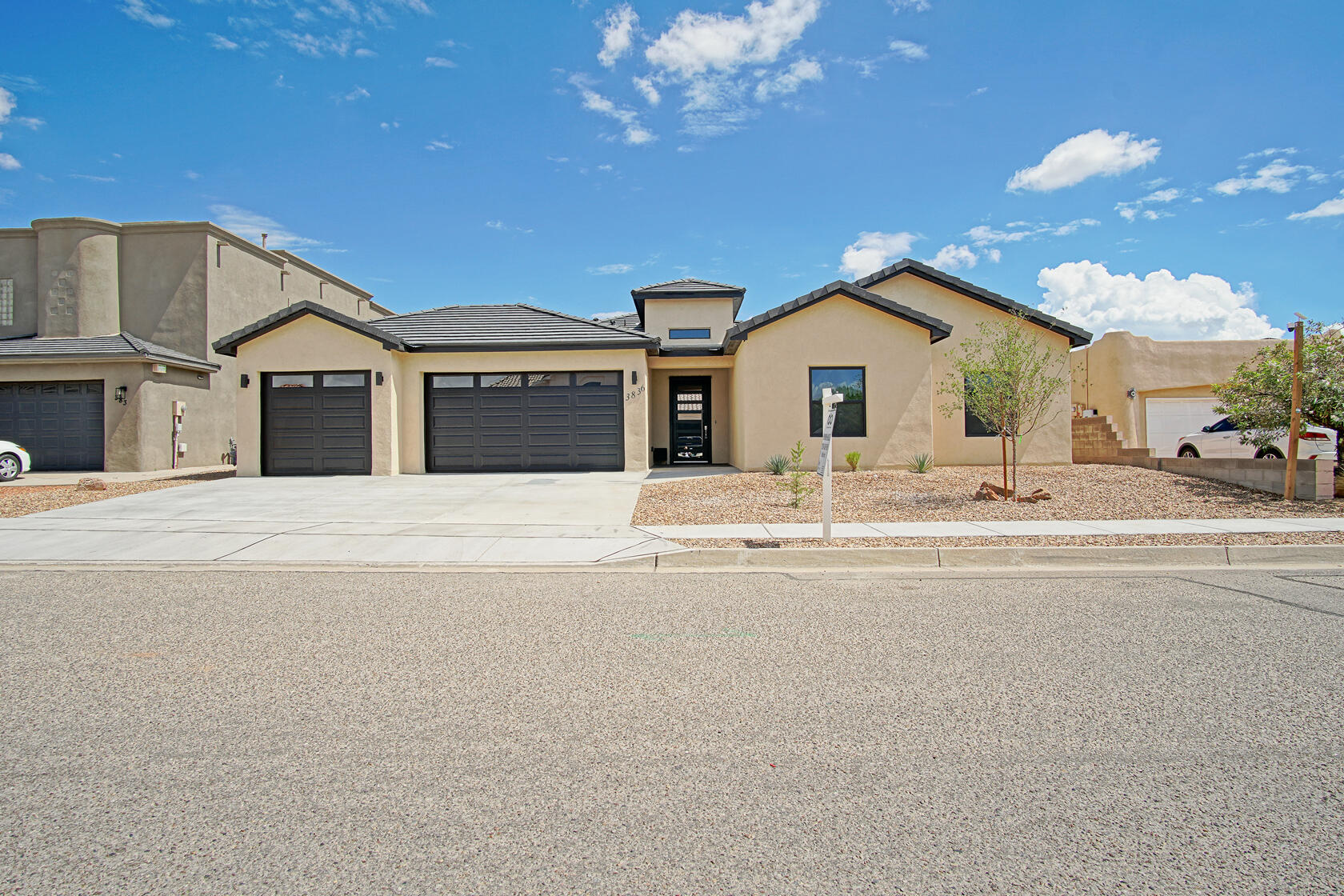 Brand NEW Custom Home awaits you nestled in a highly sought area in the heart of Rio Rancho. This pristine home is conveniently located in the Estates of High Resort. As you step inside, you're greeted by a foyer that sets an elegant tone for the home, featuring an modern ring chandelier. Beautifully designed open concept floorplan, the fireplace has an inviting glow with advanced flame technology. Chef's Dream kitchen with New appliances and a large island with a waterfall granite countertop. Primary Bedroom has a generously sized spa like bathroom with stand alone tub. Separate stand up shower with built in bench. This home is ready for entertaining with large covered back patio ready to use while enjoying the Spectacular VIEWS of the Sandia Mountains. Xeriscape landscape design
