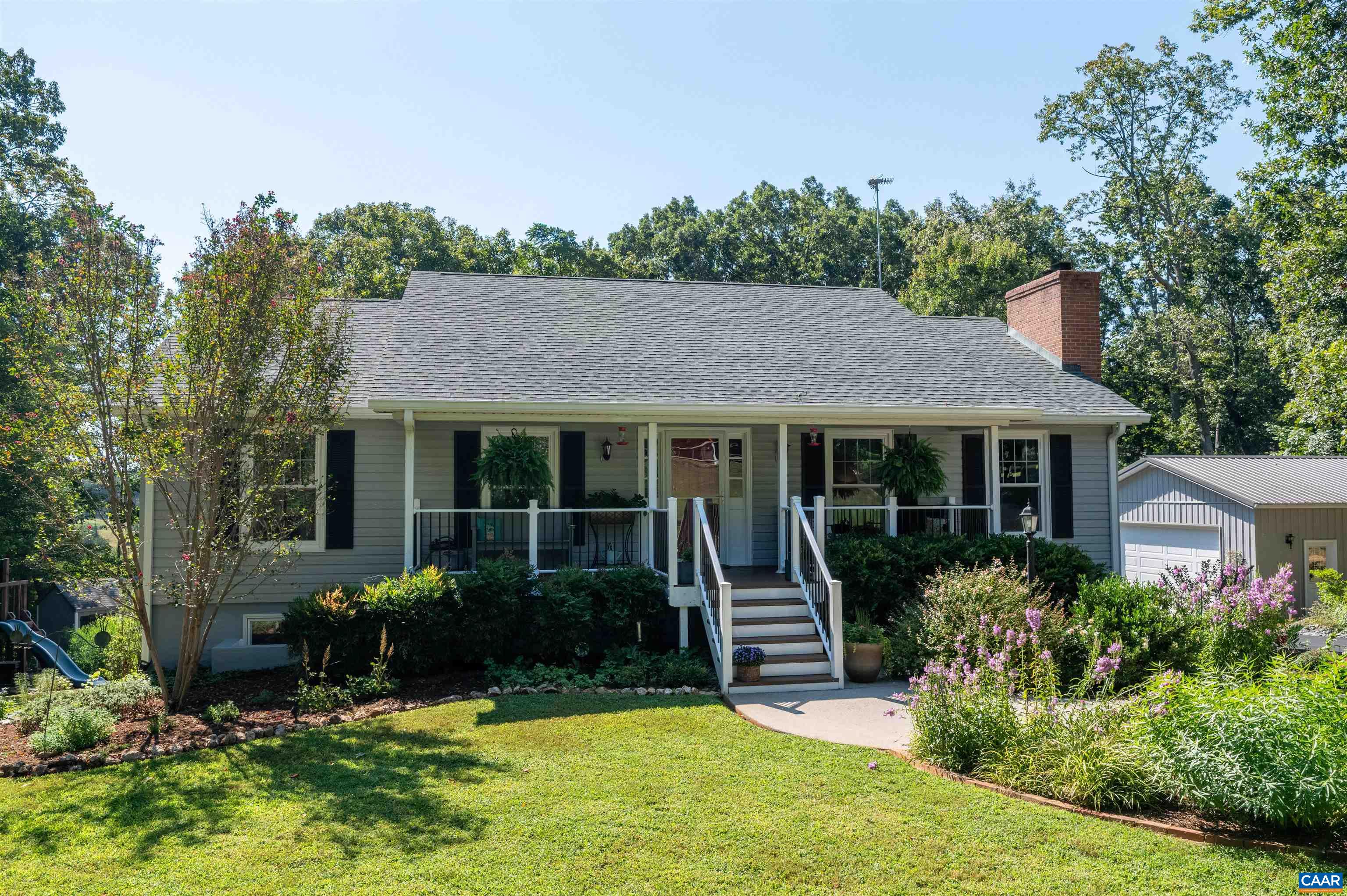Welcome home to this beautifully updated property on 2 private acres in Albemarle County. Tucked away on a quiet road, this 3-bedroom, 3-bath home has been thoughtfully improved by the current owners with a 2-car detached garage, a stunning full kitchen remodel, two bathroom renovations, new gas fireplaces, and a huge screened-in porch. The remodeled kitchen features granite countertops, custom cabinetry, and modern appliances. On the terrace level, enjoy a large family room with a gas fireplace, a full bath, French doors opening from a utility space to the backyard, and generous amounts of storage. Step outside to take in the incredible outdoor living areas—perfect for fall evenings—with a spacious patio, newly paved asphalt driveway, and 24x24 detached garage offering parking and workshop space. Major system updates add peace of mind, including a new roof (2019), American Standard HVAC (2018), water heater (2022), well pump (2015), and septic pumped/inspected (2025). Additional features include fresh paint, new windows, fireplace upgrades, outdoor kitchen, and countless thoughtful details that make this home truly move-in​​‌​​​​‌​​‌‌​‌‌‌​​‌‌​‌‌‌​​‌‌​‌‌‌ ready.