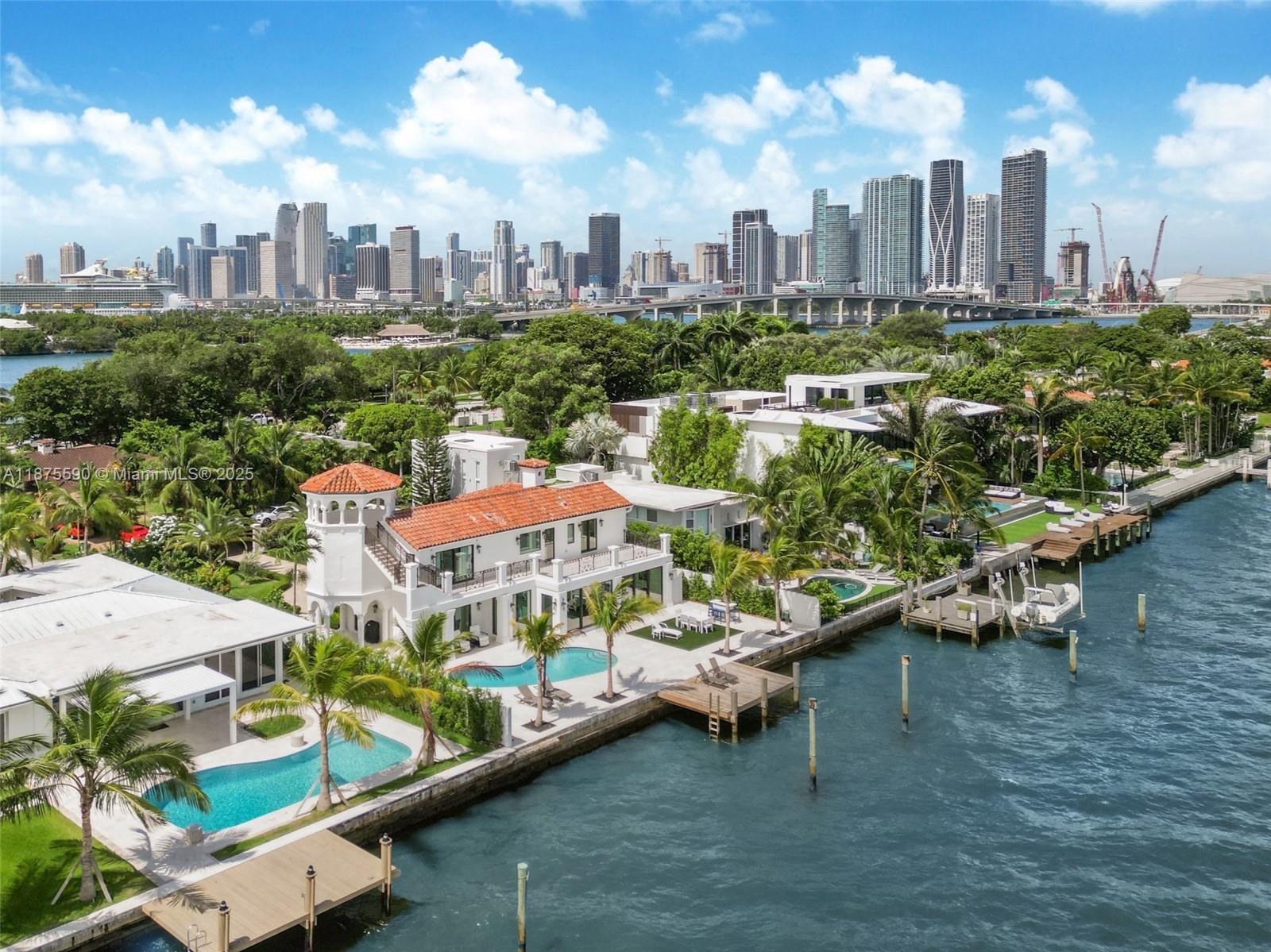 Beautiful Mediterranean Villa w/direct open bay views on the Venetian islands. This glamorous fully remodeled, turn-key home offers the BEST VALUE on the exclusive Venetian Islands, a premier location in Miami waterfront, minutes from Miami Beach and Downtown Miami. On a rare extra-wide 12,750 SF and 85 FT of open bay, it boasts a Mia Cucina chef's kitchen, Wolf-Subzero appliances, impact windows, and telescoping sliding doors that create seamless indoor-outdoor living. Maturely landscaped, the house is surrounded by extra-high grandfathered masonry walls and a gate to ensure a unique private living space.This fully automated stunning 5 bd, 5.5 bth jewel, with each bdrm ensuite, is truly one of a kind, making it an unbeatable value for an estate on the exclusive waterfront Venetian Islands