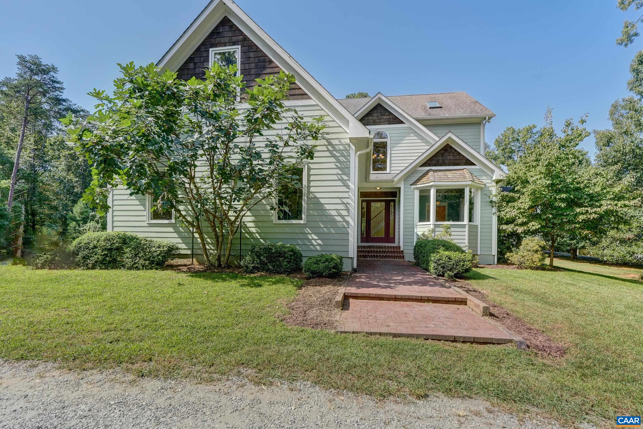 At the end of a meandering drive that winds through woods before breaking out in the open, is a remarkably well constructed, thoughtfully designed & detailed 4 bed/4.5 bath craftsman farmhouse in the heart of Ivy. The 4+ acre parcel provides expansive, level lawns, seasonal mountain views from covered blue stone porches, a creek & woods to explore. Gourmet kitchen, butler's pantry & service area feature counters made of walnut harvested on site and hardwood flooring throughout the home stuns. You'll love the 2 wood-burning fireplaces in living room and primary bedroom,  wrap-around porch off kitchen/family room. Each bedroom features a private ensuite bathroom and the home features a huge finished basement w/ full bath, wine cave, lots of conditioned storage, and rough-ins for sauna and kitchenette. Nature lovers will love the abundant gardens with fig trees, grapevines, apiary, and more! Solar panels and geothermal heat pump make this home so energy efficient. Under 10 mins to Charlottesville & moments to charming Ivy amenities.