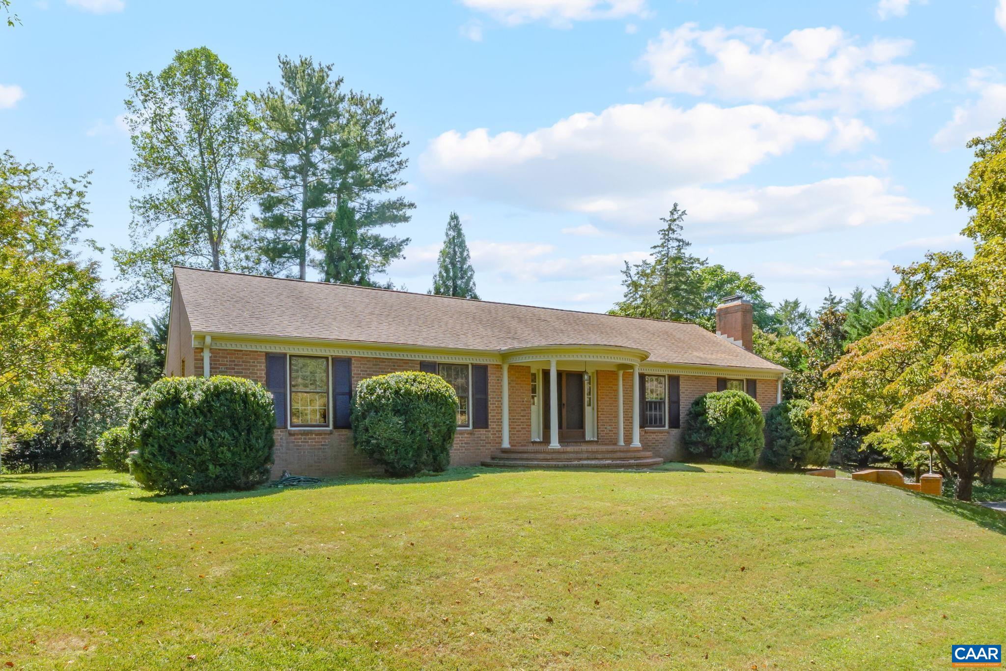 This classic all-brick ranch sits on an elevated, level lot in the private northern section of Carrsbrook—one of Charlottesville’s most established and convenient neighborhoods. With timeless curb appeal and a versatile floor plan, the home offers comfort, flexibility, and abundant natural light. The centerpiece is the sun-filled sunroom with wood stove, overlooking the private backyard and seamlessly extending the main level living space. The main floor also features spacious living and dining rooms with large windows, a well-appointed eat-in kitchen, and generously sized bedrooms. The finished basement adds valuable living area with two large bedrooms, a full bath, a rec room with a gas fireplace, and ample storage. Recent updates include newer HVAC, updated electrical panel, newer kitchen appliances, refinished wood floors, newer windows in the sunroom, gas fireplace, and newer basement carpet. Just minutes to UVA, the airport, shopping, schools, and downtown, this Carrsbrook gem combines classic charm with modern convenience—and plenty of space for everyone to spread out.