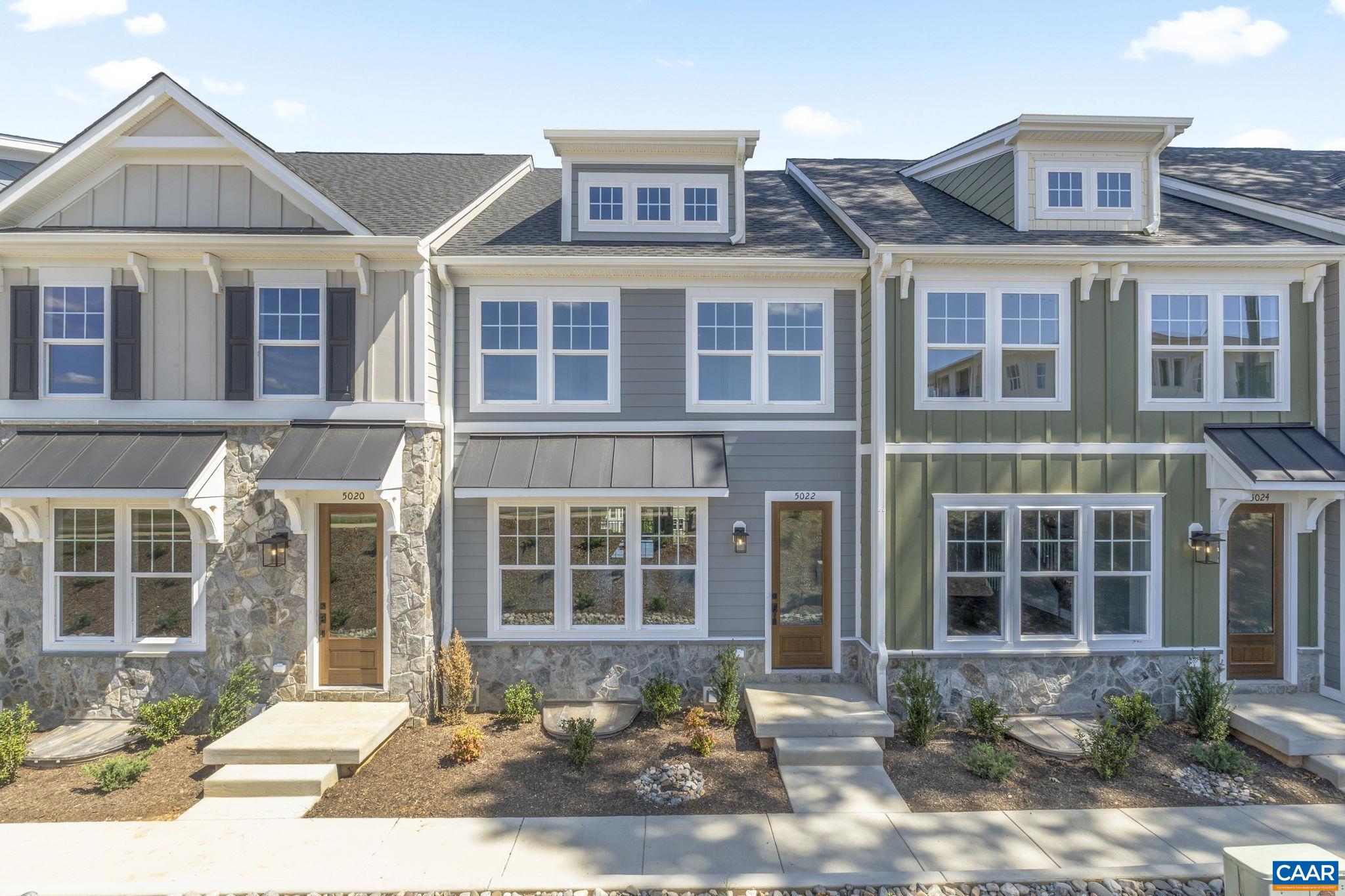 Just completed and move-in ready! This finished Dogwood townhome in Dunlora Park is ready for its first owner. Set just minutes from Downtown Charlottesville, this farmhouse-style, earth-friendly townhome offers two finished stories plus a basement with a rec room, half bath, and rear-entry 2-car garage. Inside, you’ll find no carpet anywhere—just durable LVP flooring throughout the bedrooms and living spaces. The open main level features a gourmet kitchen with a wall oven, hood vent, custom cabinetry, oversized central island, walk-in pantry, and stainless steel appliances. Upstairs are the primary suite, two additional bedrooms, a full hall bath, and laundry. Other quality finishes include oak stairs, solid core doors, wood shelving, upgraded trim, and an energy-efficient furnace. Actual photos!