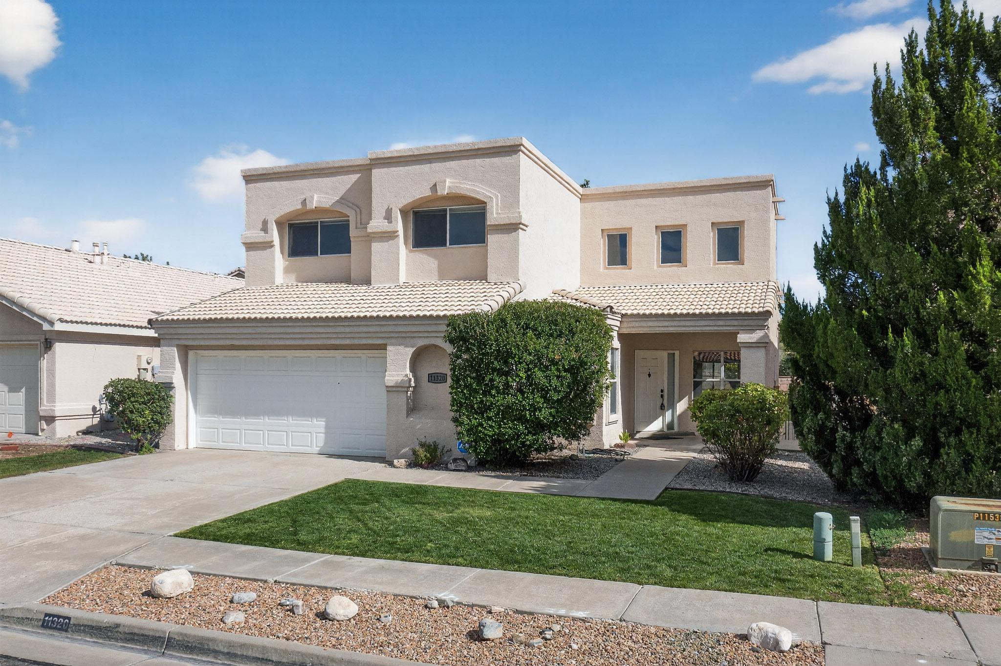 Nestled in the quaint Willow Wood neighborhood of Albuquerque, this beautiful 4 bedroom 3 bath home is ready for move in!  Located in an area close to popular shopping, desirable school districts, freeway access and a quick trip to our beautiful Sandia Mountains, you'll immediately fall in love with the location!  The home itself is a beautifully functional floorplan with character and style throughout.  Upon entry you will find ample space for living that seamlessly leads to the adorable kitchen.  The home boasts a beatiful bakyard with mature vegetation and real grass to enjoy our 300+ days of sunshine every year.  On the crisp Albuquerque nights, the gas log fireplace will keep you cozy warm.  Bonuses include a balcony that offers outdoor access, and storage racks in the garage.