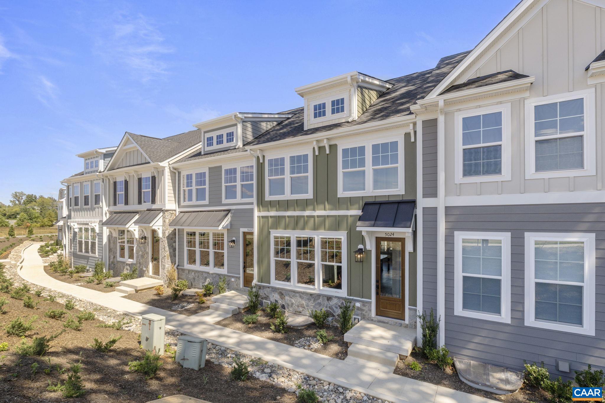 Just completed and move-in ready! This Dogwood townhome in Dunlora Park is now finished, and the photos show the actual home. Located just minutes from Downtown Charlottesville, this earth-friendly, farmhouse-style home offers two finished stories plus a basement level with a rec room, half bath, and rear-entry 2-car garage. The main level features an open layout centered around a kitchen with an oversized island, luxe cabinetry, a walk-in pantry, and stainless steel appliances. Upstairs, you’ll find the primary suite, two additional bedrooms, a full hall bath, and laundry. Quality finishes are found throughout, including oak stairs, solid core doors, wood shelving, upgraded trim, and an energy-efficient furnace.