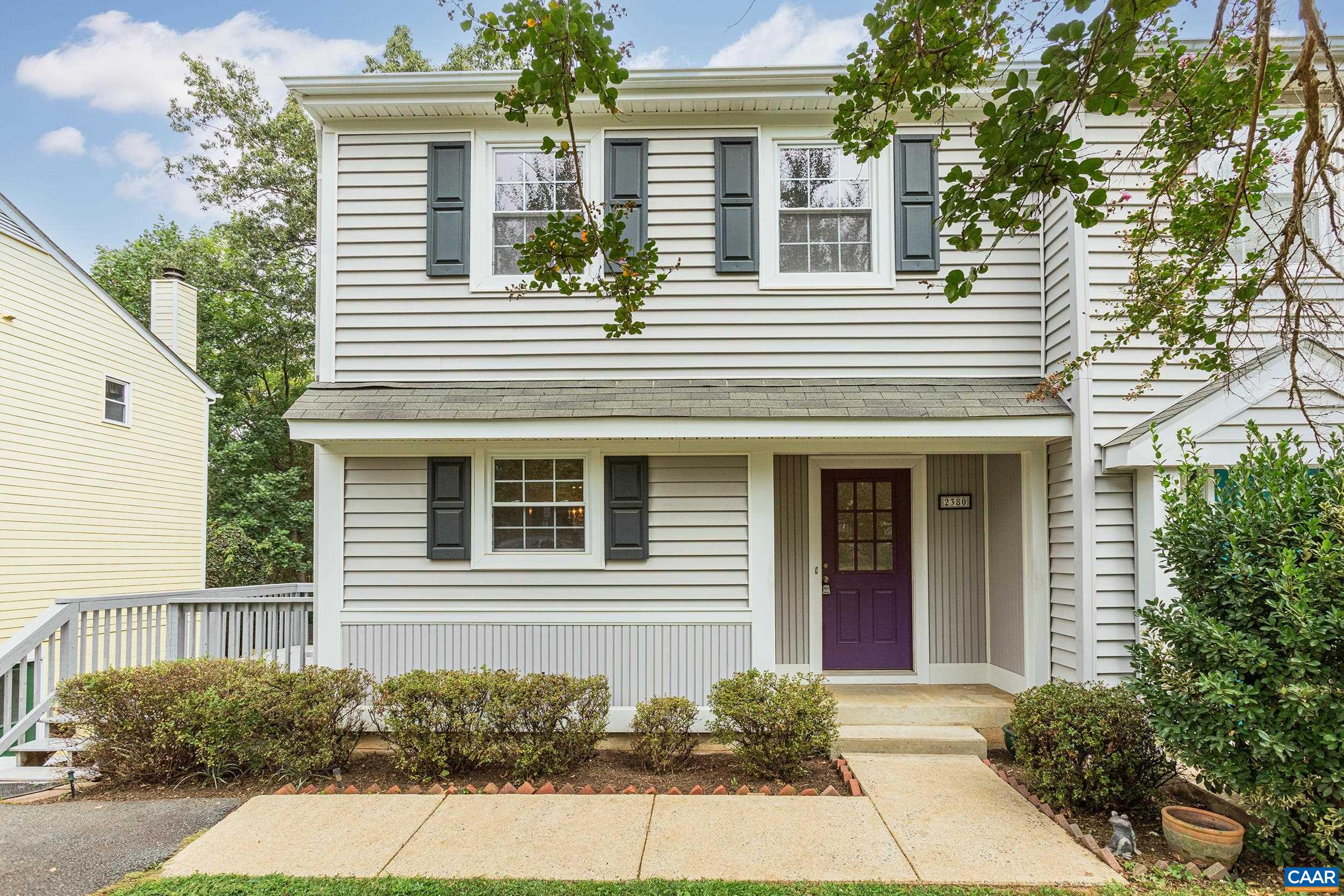 Welcome to this charming townhome, that is part of a duplex, located in the desirable Briarwood neighborhood. This 3-bedroom, 2.5-bath home offers a warm and inviting layout with thoughtful updates including brand new carpet throughout.  Step into the cozy living room, complete with a fireplace that adds warmth and character—perfect for relaxing evenings. Just off the living room, the dining area is ideal for both casual meals and formal gatherings.  The generously sized kitchen features modern cabinetry and ample prep space. It overlooks the expansive back deck, offering seamless indoor-outdoor living.  Upstairs, the large primary bedroom includes a lovely ensuite bathroom, providing a private retreat at the end of the day.  The finished lower level includes a spacious rec room—great for a home office, gym, or media space—as well as a dedicated laundry room for added convenience.  Out back, enjoy a fully fenced, lush green yard with direct access from the deck. The home backs to trees, offering peaceful views and added privacy.  Located in a scenic area close to outdoor recreation, including Piney Mountain, and just minutes from the Charlottesville Airport, this home is perfectly situated for both tranquility and convenience.