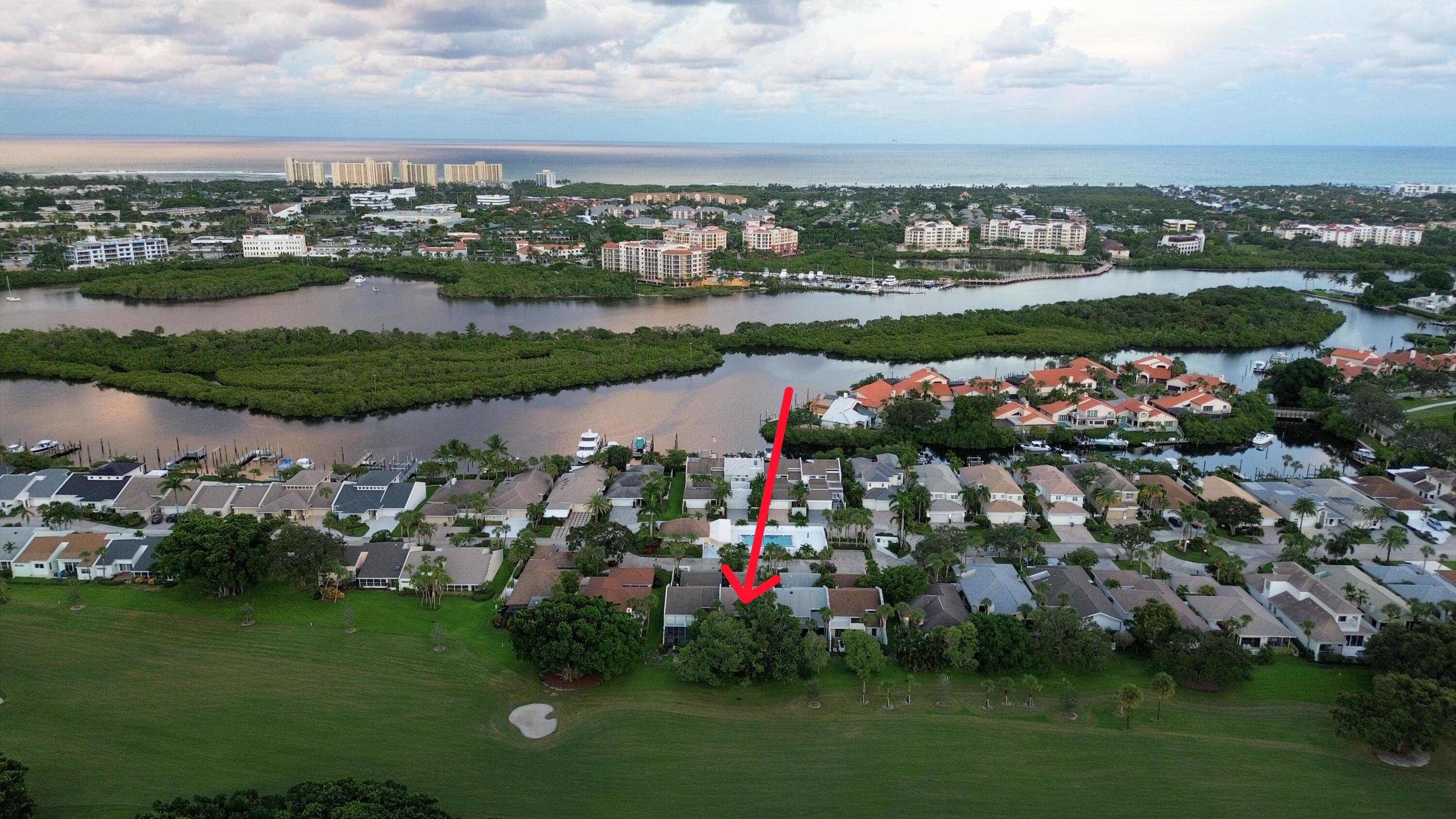 Amazing opportunity to own a 3 bedroom, 3 bath townhouse with an oversized 2 car garage on the Jonathan's Landing village golf course. Tropically landscaped front yard, walkway and back yard. Back patio where you can soak in the spa in your private backyard oasis covered from the rain. Mature landscaping provides sun protection with a western exposure. AC and water heater both replaced in 2024. AC has an automatic pump to clear the drain line installed in the attic. Roof replaced in 2018. FPL surge protector installed. Across from the community pool with ample guest parking. 24 hour gated access in one of Jupiter's finest non-mandatory membership golf communities. Several levels of membership are available if desired.