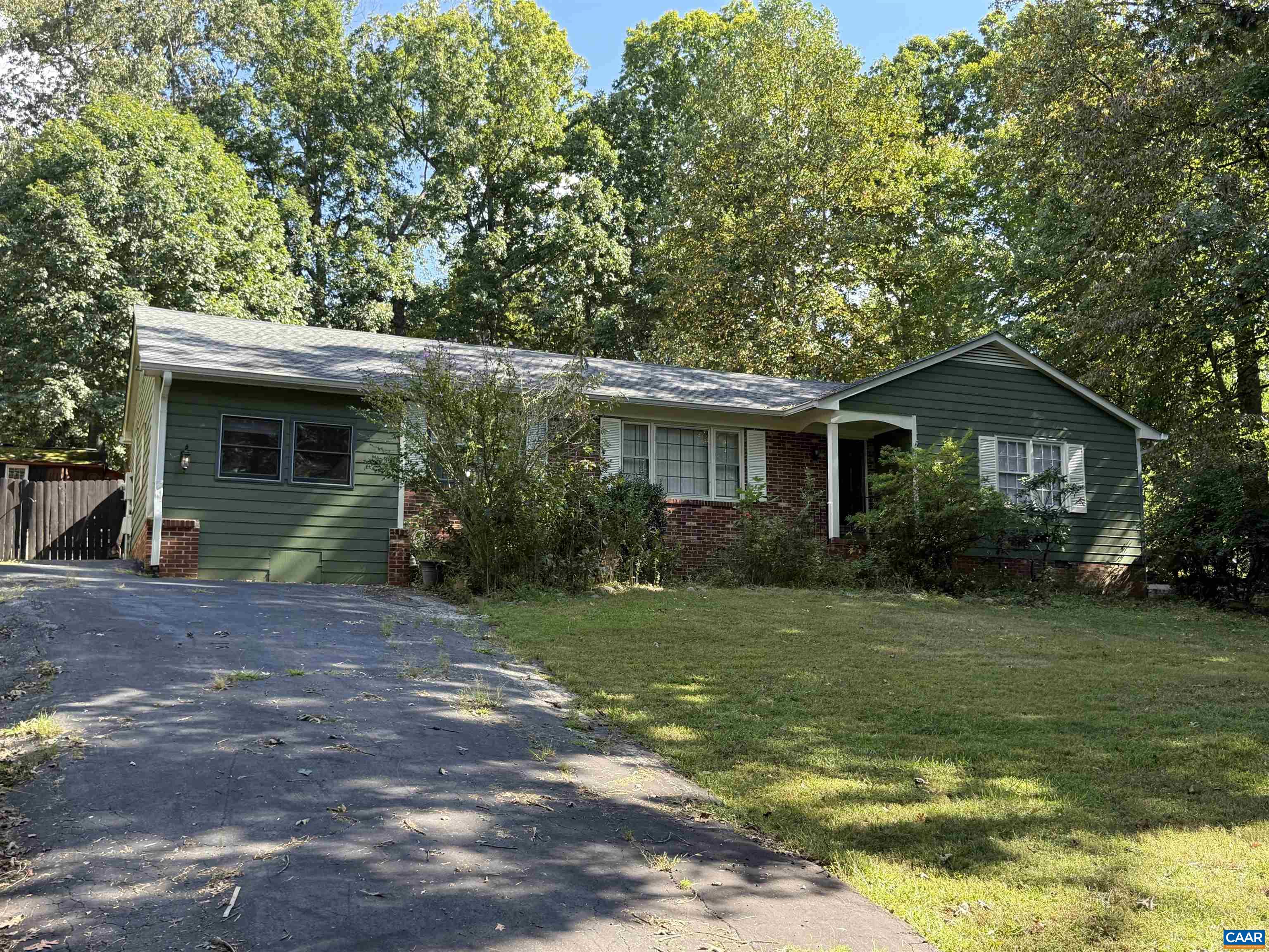 Charming brick home located in a desirable neighborhood, offering plenty of space and potential. This 3-bedroom, 2.5-bath property includes an additional bonus room, perfect for an office, playroom, or guest space. The home features a driveway in both the front and back, providing convenient parking and easy access. While the house is in need of some care and updating, it has solid bones and great curb appeal. With a little vision and attention, this property could be transformed into a beautiful family home in a sought-after location.