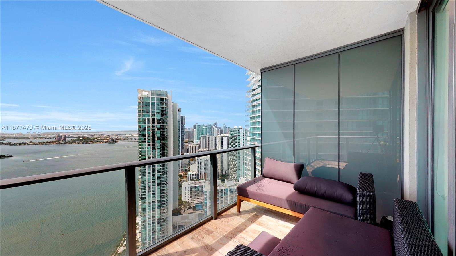 TURN-KEY OPPORTUNITY | FULLY FURNISHED | Soaring on the 46th floor of Paraiso Bay, this 1 BED + DEN, 2 FULL BATH residence offers breathtaking unobstructed views of Biscayne Bay, Miami Beach & the ocean from expansive floor-to-ceiling glass and a private balcony. Featuring sleek modern finishes, porcelain floors, gourmet kitchen with Sub-Zero & Bosch appliances, and a versatile den for office or guest use. Enjoy 5-star amenities including a lagoon-style pool, spa, fitness center, tennis, wine + cigar room, bowling alley & much more. Located in Edgewater, minutes from the Design District, Wynwood & Downtown.