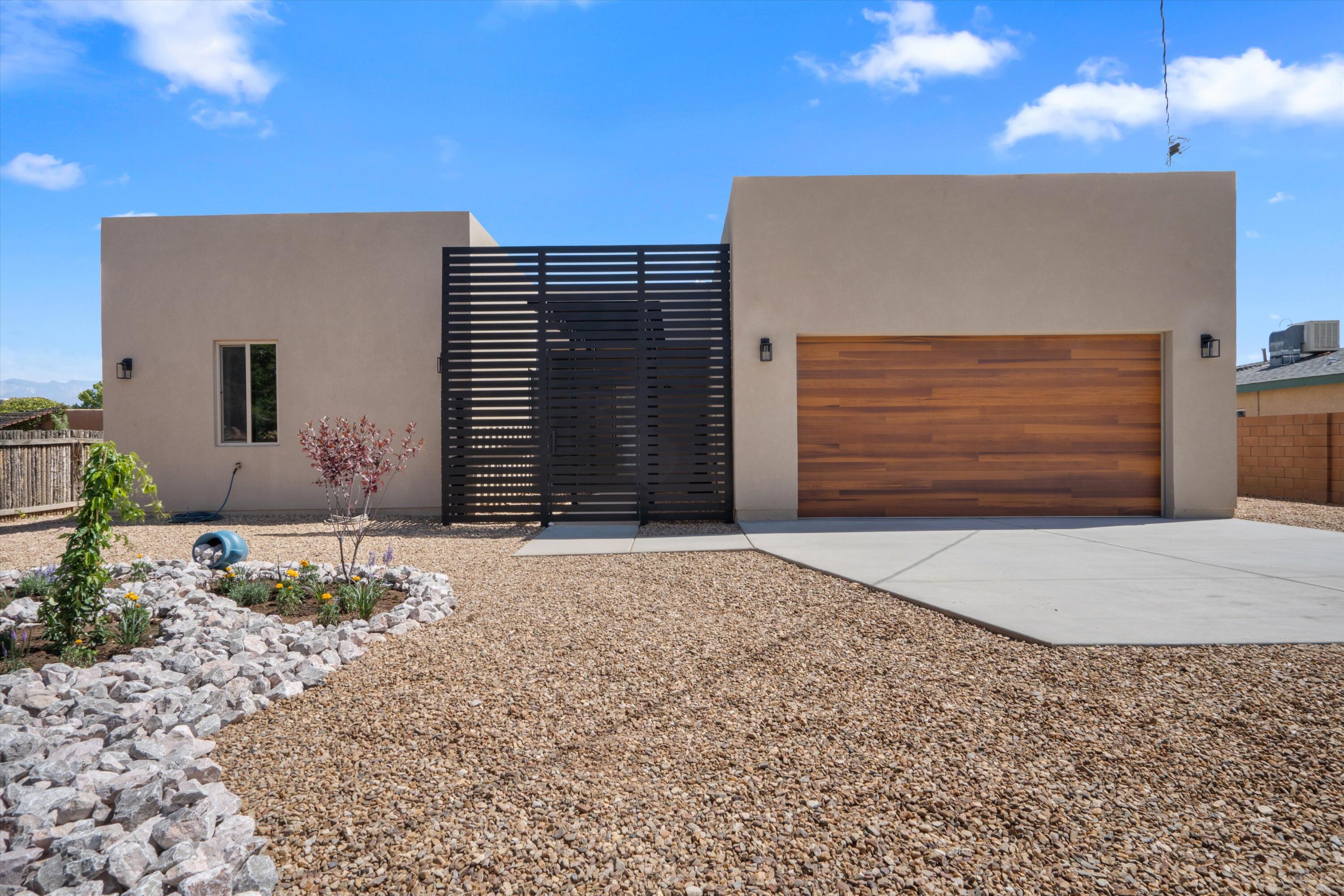 2025 New Construction! Stunning custom contemporary home in the desirable North Valley. Enjoy a gated entrance for added security and privacy on a spacious .32-acre lot--perfect for creating your dream backyard or even adding a pool.This thoughtfully designed residence features four bedrooms, three bathrooms, and a two-car garage. Built with modern efficiency in mind, the home includes high-efficiency heating and cooling systems and a durable TPO roof backed by a five-year warranty. Spacious side yard ideal for parking your recreational vehicles.