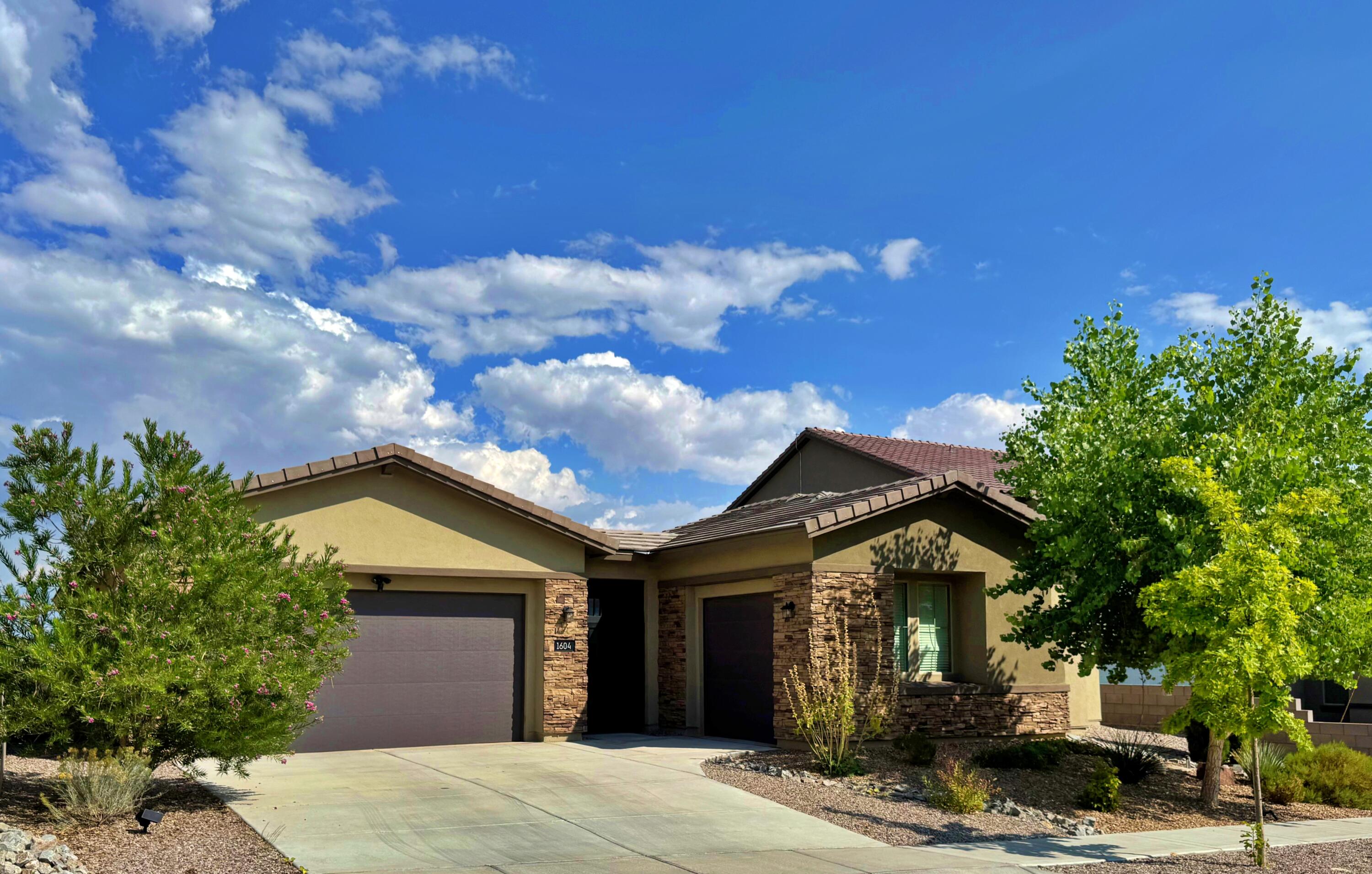 Welcome to Inspiration--Pulte's 4-years-young gated NW Heights community on top of Savio Ridge, where the city views stretch from the Foothills to the Rio. 1604 Deer Valley Trail, a Greenbuilt NM certified home, is a super spacious single-level home, with easy access to the private community park, & adjacent to the famed Petroglyph Monument. Come in...Notice: the excellent entry courtyard, the large Great room w/ space for everyone, yet designed for intimate gatherings. Amazing Chef's kitchen, with huge island, b'fast bar, walk-in Pantry & Cafe Corner, for all beverage needs. More: two Primary bedrooms, each nicely separated for optimum privacy; a Flex room & an Office; 3 garage bays; close to I-40. The east backyard covered patio is amazing. See the 3D Tour, then come see this house!