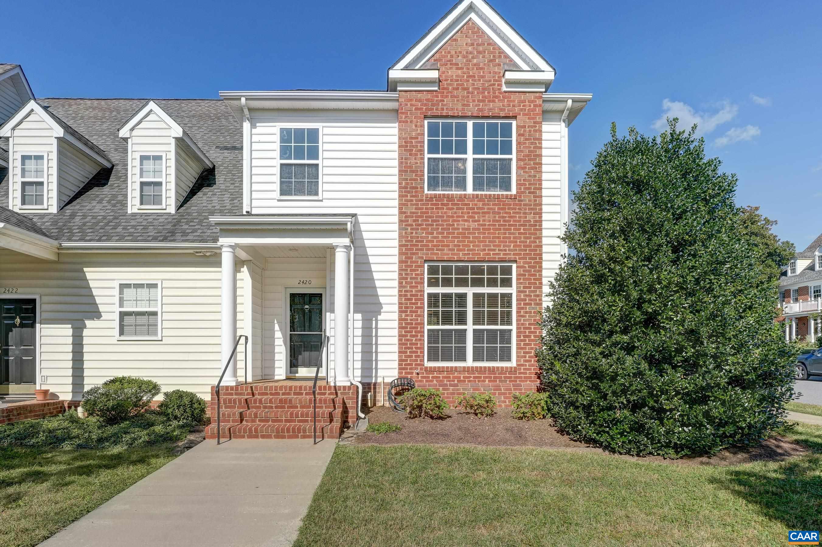 Light-filled 3BR/2.5BA end-unit townhome with hardwood floors, neutral paint, and a dedicated parking spot right out front. Just across the street from Crozet’s popular Old Trail community, this home offers the same sought-after location, green space, and mountain views—without Old Trail prices. The large kitchen features painted cabinets, new stainless sink, stainless steel appliances (updated in 2024), and space for an island or eat-in area under a large picture window. A generous pass-through opens to the dining/living room with gas fireplace, built-ins, and access to a covered porch overlooking the common green, fire pit, and mountains. Upstairs, the primary suite includes a walk-in closet, sliding privacy door, and private bath with double vanity and tub/shower. Two additional bedrooms share a full hall bath. Laundry is upstairs with full-size LG washer/dryer (2024). Other 2024 updates include new carpet and blinds/window treatments throughout. A newly insulated, locking storage room off the porch provides even more utility.