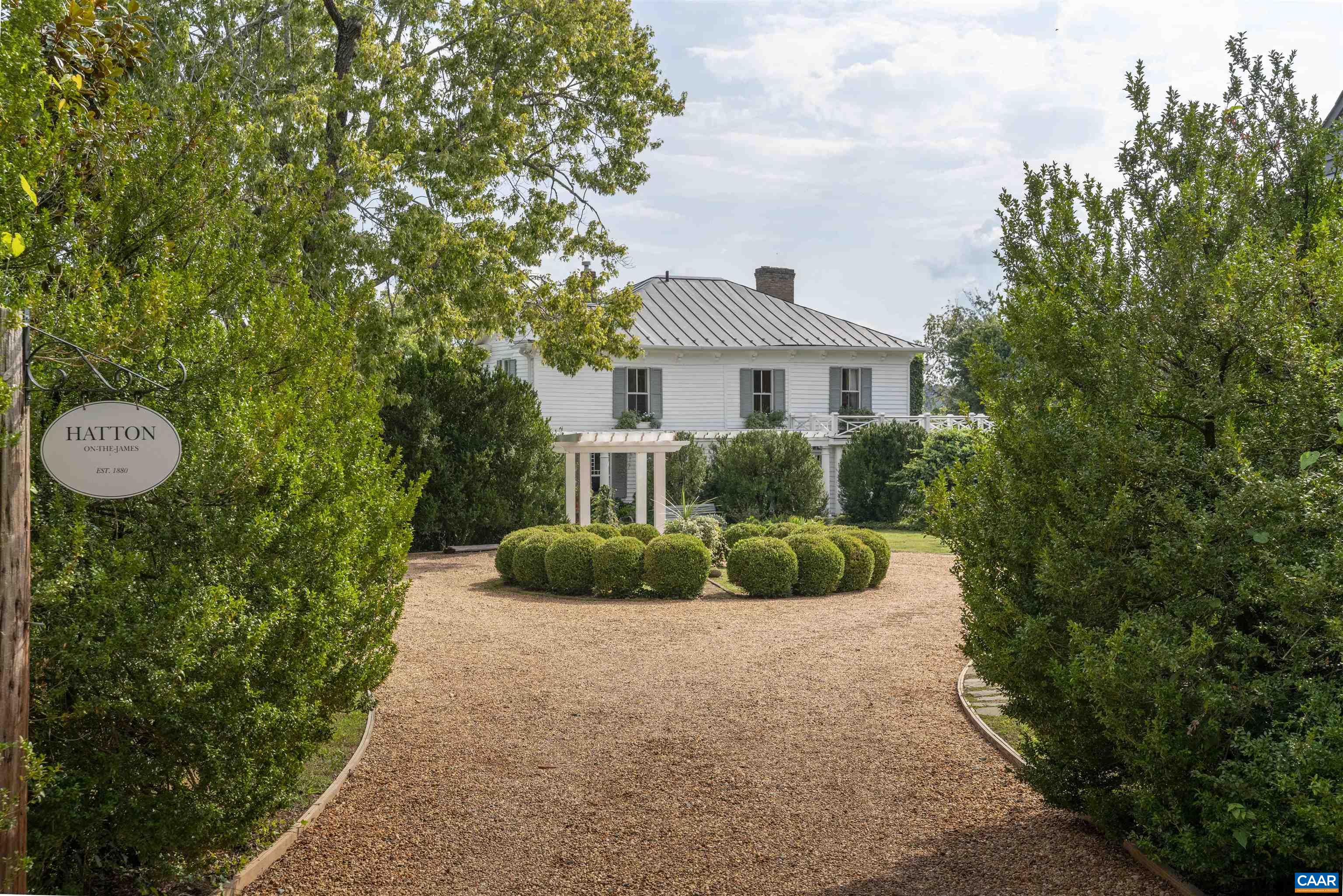 History. Authenticity. Charm. Hatton is a circa 1880 iconic Albemarle County estate set on 13.9 peaceful acres with frontage on the James River...Lovingly & gently restored over the past 20 years, the gorgeous heart pine floors, original moldings, woodwork, plaster walls, mantles & staircases have retained their classic simplicity & beauty...Light pours in though the banks of windows that open to beautiful vistas. A double staircase leads from the front center hall to the open second floor landing. The 500 sq.ft. wrap-around porch provides airy additional living areas as well as sweeping views.  Grounds consist of extensive gardens, walkways and allees: more than 70 boxwoods, many originate w/the house, numerous perennials as well as hardscapes of flagstone, brick & soapstone. In addition are several significant renovated outbuildings: a charming, rustic one bedroom guest cottage w/kitchenette, living room, bath & laundry, a cute gardener's shed & a recently completed writer's studio. A sizable barn/boathouse would adapt to a variety of uses; Easy access to water activities. 19 miles to Charlottesville...Private & secluded, yet not isolated...DO NOT TRY TO SEE THIS PROPERTY WITHOUT AN APPOINTMENT...ACCESS IS THROUGH A FARM...