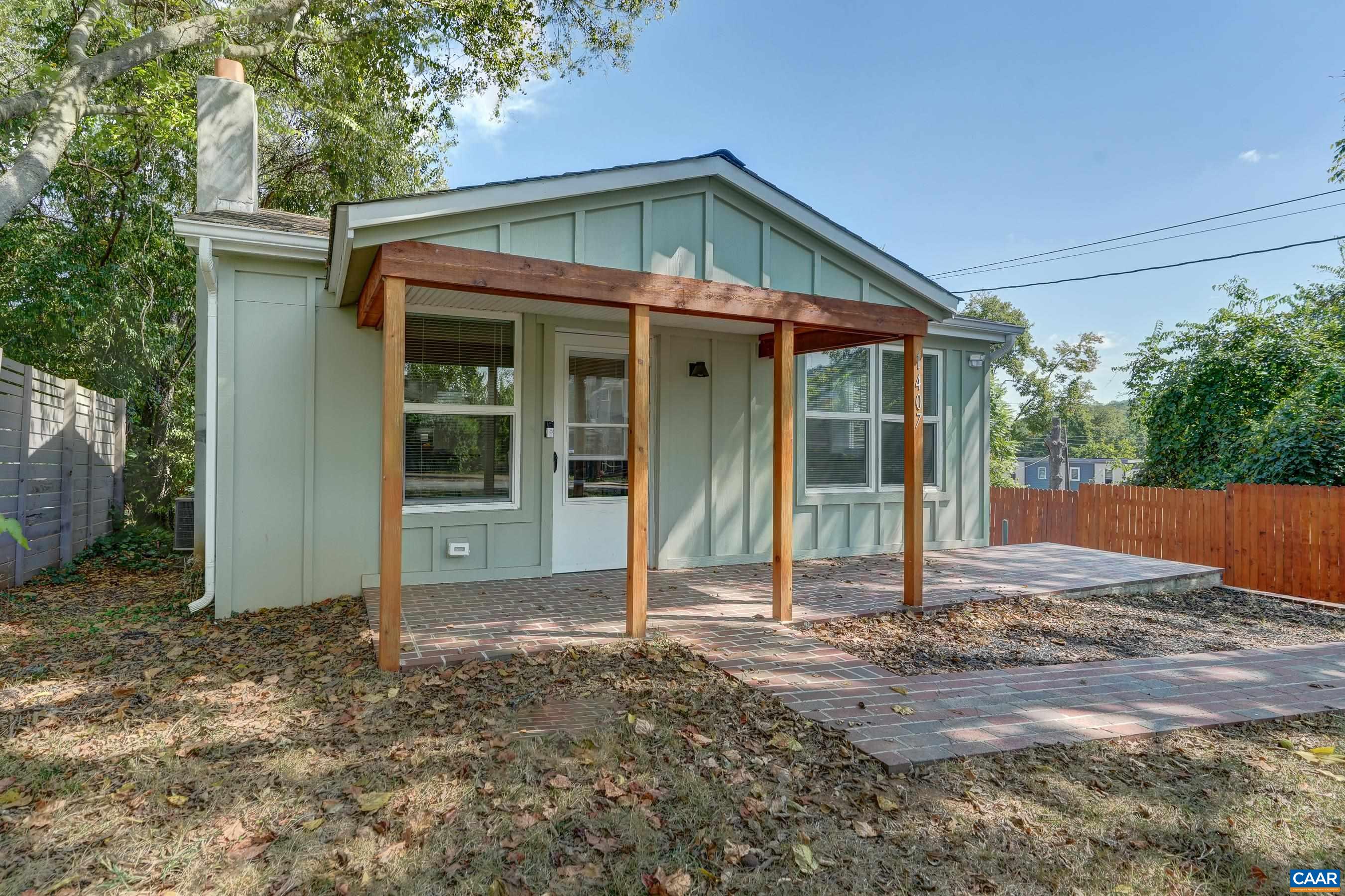 COMPLETELY renovated 1960s cottage with a mountain view from the front porch. Minutes to Rives Park, downtown Charlottesville, Martha Jefferson hospital, UVA Medical center and more! All new installs including appliances, heat pump, electrical wiring, windows, roof, plumbing and insulation. This adorable cottage boasts original pine floors in the common areas, newer oak floors in the bedrooms, original brick accent wall, two bedrooms and two full baths. The kitchen features painted wood cabinets, under-cabinet lighting, new stainless appliances, and butcher block counter tops. The primary suite features access to the new rear deck, two closets, a remodeled ensuite bathroom with sliding barn door, and beautiful tiled, frameless glass shower.  Second bedroom and remodeled full bathroom too.  This home includes remote controlled ceiling fans in both bedrooms,  multiple off-street parking spots, partially fenced back yard, new back deck and bricked front walk/patio.  Large shed for storage in the rear yard too! This home is a must-see!