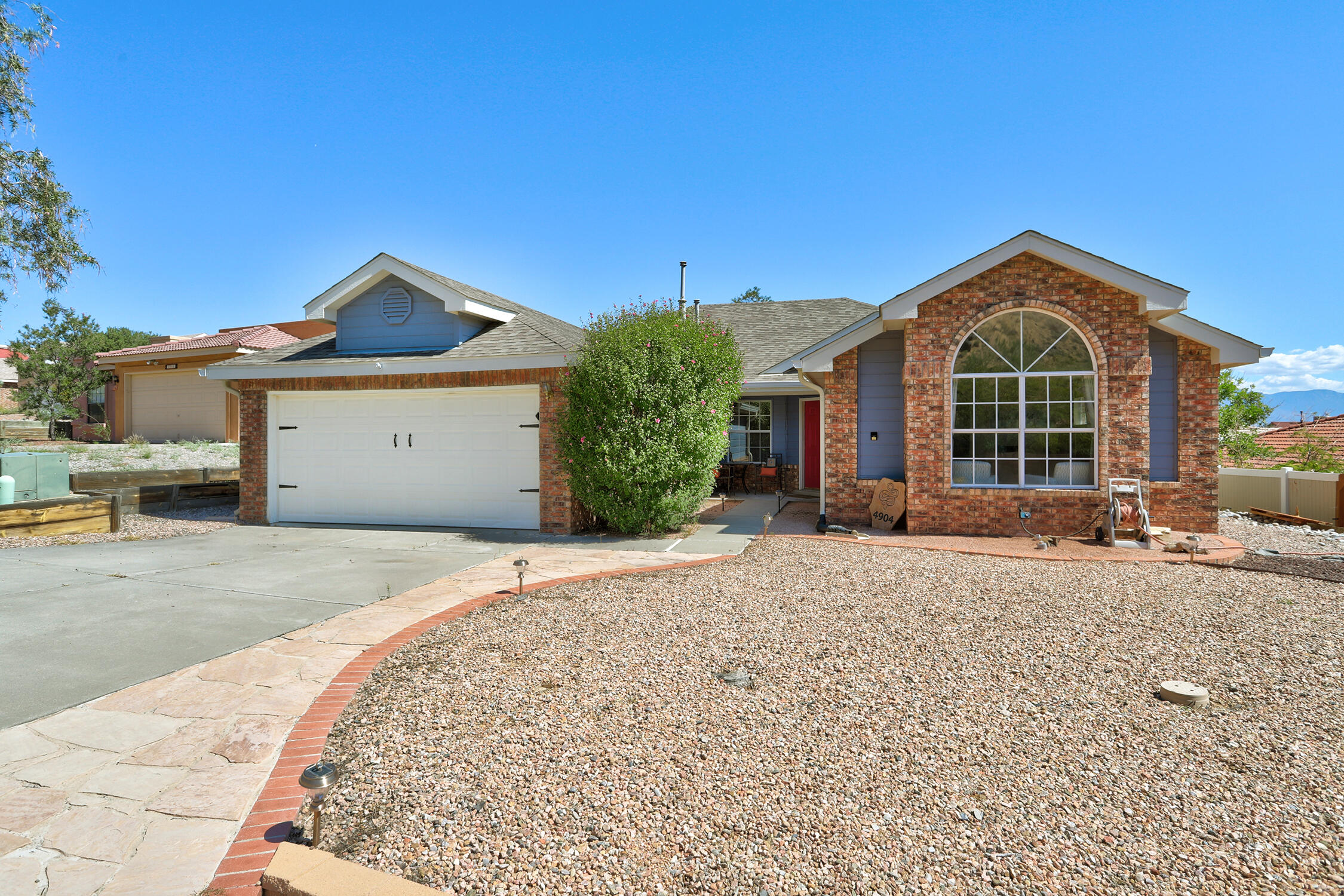 Beautiful 4-Bedroom, 2-Bath Single-Level Home with Stunning Views! All-brick, single-level home sits next to the scenic Petroglyph National Monument, offering breathtaking views and abundant natural light throughout. Featuring two spacious living areas, a bright, open layout, and no interior steps, this home combines comfort with convenience.Recent updates include a new roof in 2019 and refrigerated air conditioning for year-round comfort. The primary suite boasts a large walk-in closet, while the elevated lot provides a charming backyard perfect for relaxing or entertaining.Located just minutes from Paradise Hills and only 10 miles from downtown Albuquerque, you'll enjoy the perfect balance of peaceful surroundings and easy city access.Don't miss your chance to see this inviting home