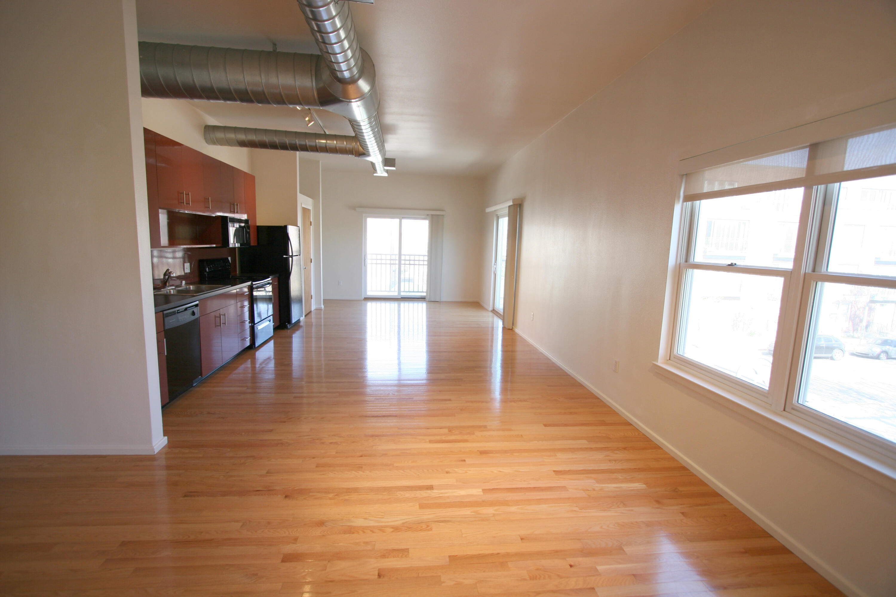 This spacious 2-bedroom, 1.75-bath condo offers 1,224 square feet of comfortable living in the heart of downtown Albuquerque. Just steps from the Rail Runner, local hospitals, restaurants, and the University of New Mexico, the location makes errands and evenings out a breeze. Inside, the open floor plan maximizes space, providing a welcoming flow between living, dining, and kitchen areas. The unit features secure building access, giving peace of mind whether you're home or away. With Civic Plaza nearby for outdoor enjoyment and public transportation practically at your doorstep, this is city living made easy--and without the need for a car or a compass.Secure your special place today!!