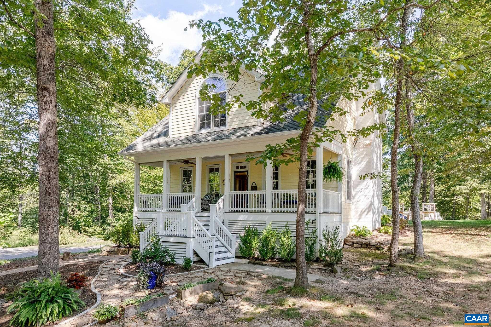 CHESMONT is an inviting country retreat, 18 miles south of Charlottesville, in the quiet hamlet of Esmont. The property blends rural charm with surprising versatility. The main residence offers generous living space anchored by a bright open-concept kitchen/dining/living area - perfect for gathering. A first-floor primary suite provides convenience, while the sun-filled first-floor Office invites creativity. Upstairs you’ll discover bedrooms and a family room with four built-in bunkbeds, plus a hidden play nook disguised as a closet, making the home especially fun for young visitors. Front and back porches offer extra living space in shade or sun. Terrace level includes a workshop and sewing room, ideal for hands-on projects and hobbies.  Beyond the home, the Cottage with Garage creates flexible space for guests, extended family, or rental income. A substantial Barn (C: 2022) and chicken coop add to the property’s utility, while the current owners’ craftsmanship shines through in a stacked-stone water feature, fire pit, and multiple gathering spots around the grounds. With room to breathe, space to create, and thoughtful touches throughout, "Chesmont" is more than a property - it's a lifestyle. Come see what all the fuss is about!