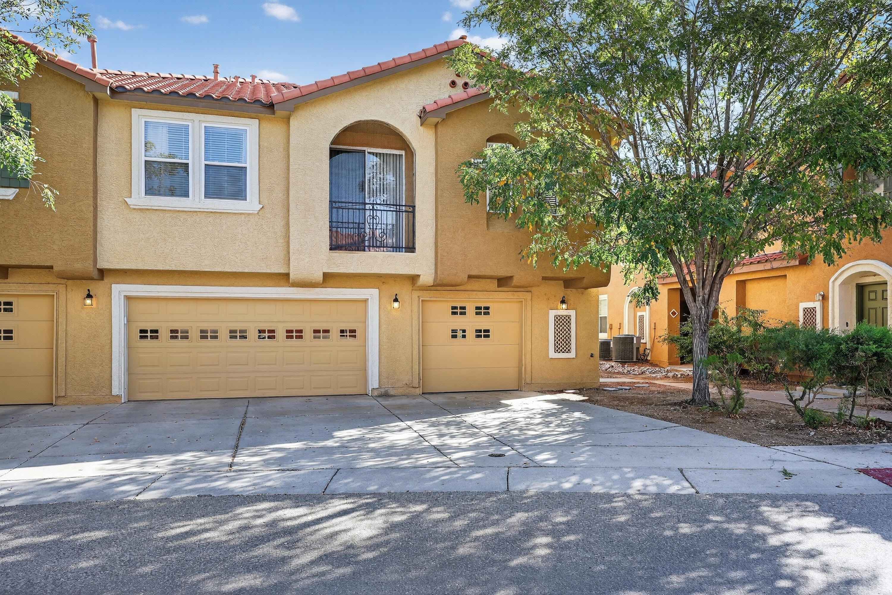 Welcome to The Villas, a gated community with a sparkling swimming pool, clubhouse, and playground.  This lovely 2-bedroom, 2-bath condo has an open-concept layout where the kitchen flows seamlessly into the living room and dining area.  Kitchen features a breakfast bar, stainless steel appliances, recessed panel cabinets, recessed can lights, and pantry.  Dining area opens to private balcony.  Spacious primary suite features dual sinks, garden tub, and walk-in closet.   Other features include tankless water heater, refrigerated air, and front-load washer/dryer.  Convenient to I-25, UNM, hospitals, downtown, and much more!    Schedule a tour today!