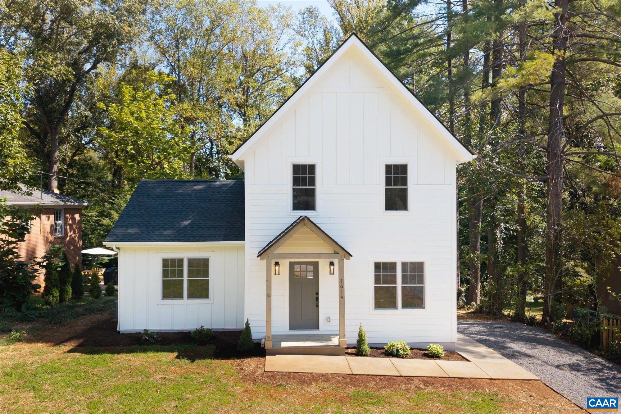 Meticulously remodeled and thoughtfully expanded, this charming cottage blends timeless neighborhood character with modern fit and finishes. Set in one of Charlottesville’s most desirable neighborhoods, the home offers a unique opportunity to enjoy the feel of new construction in a classic, established setting. The open great room and chef’s kitchen—complete with quartz countertops, tile backsplash, stainless steel appliances, and range hood—open seamlessly to a spacious deck overlooking the expansive backyard. The main level offers two comfortable guest bedrooms and a full bath, while the upper level is devoted to a generous primary suite. This retreat features an abundance of closet space, a separate laundry room, and a lovely bathroom. Every detail has been addressed in this comprehensive renovation, including the addition of the second floor and expanded main level, along with all-new roof, siding, plumbing, electrical, insulation, Anderson windows, HVAC, ductwork, and high-end finishes throughout. Ideally located on a quiet street in the coveted Rugby area, this home is just minutes from UVA, downtown, and all that Charlottesville has to offer.