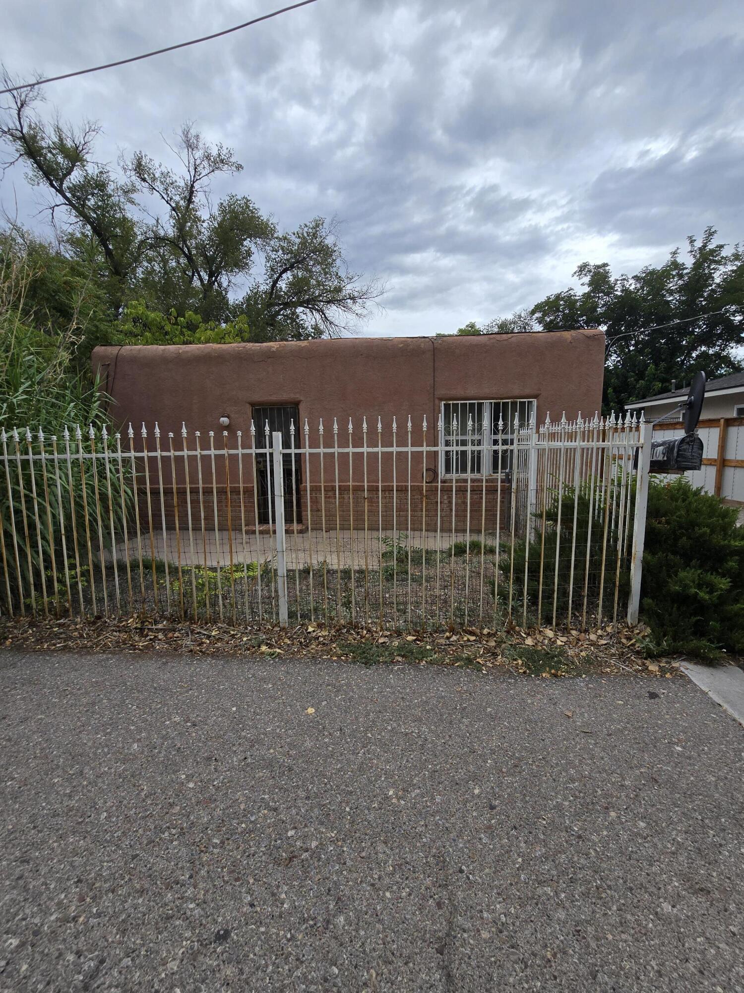 SOLD AS-IS-Handyman special! Two bedroom, one bathroom adobe home in the heart of South Valley. Prime location, right off of Bridge and Isleta; close to many restaurants, entertainment and shopping- and less than 10 minutes to downtown! Large yard and lots of potential. Come see it today!