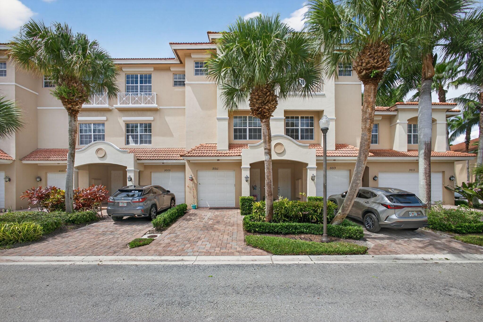 Incredibly spacious townhome in the heart of Palm Beach Gardens! This 2,986 sq. ft. residence offers 3 bedrooms plus a versatile den/office. Recently updated, featuring a redesigned kitchen with counter-height quartz countertops, new appliances, and designer fixtures. The owner's suite is a private retreat with walk-in closets and a spa-like bath. Enjoy peace of mind with hurricane impact glass, garage parking and a new A/C.  This home also features new carpet, newer, light fixtures, and new fans.  Located in a gated community with an unmanned guard gate, residents enjoy a resort-style pool and private access to the shops and dining at Donald Ross Village. Just minutes from pristine beaches, top schools, world-class golf, and PBI airport, this home combines luxury, comfort, & convenience.