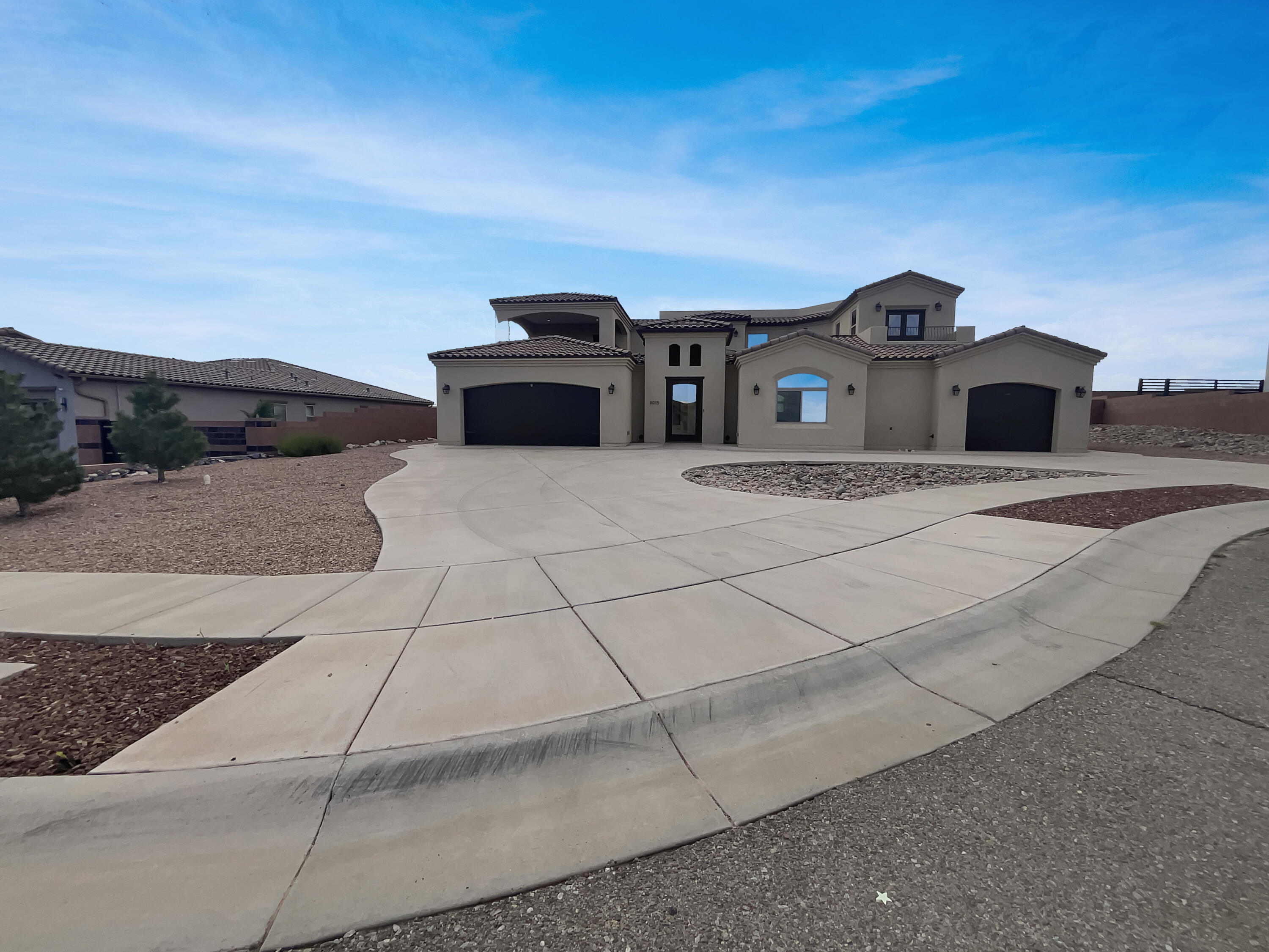 Beautiful custom home in the Petroglyph Estates subdivision with amazing views! The living room features a cozy fireplace, perfect for those chilly evenings. The kitchen is a chef's dream with all stainless steel appliances, a kitchen island for extra prep space, and an accent backsplash. The primary bathroom with double sinks, a separate tub, and shower. The primary bedroom features a spacious walk-in closet. The kitchen also includes a walk-in pantry for ample storage. Partial flooring replacement adds a fresh touch to the home. The outdoor space is equally impressive with a covered patio for entertaining. The fenced-in backyard is perfect for privacy and comes with low maintenance landscaping. This property is a must-see for those seeking a comfortable and stylish living environment.