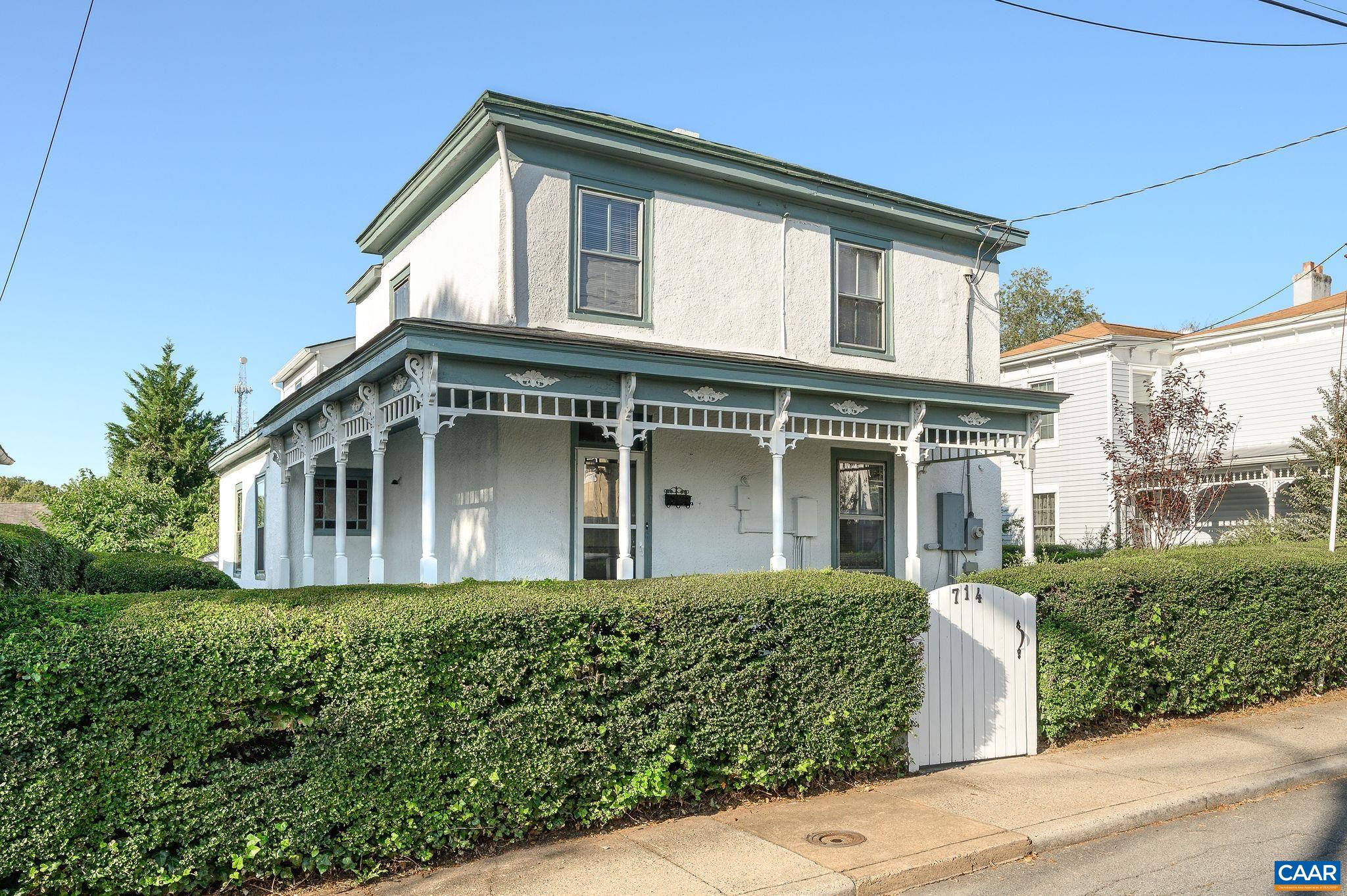 This early 1900s farmhouse blends historic charm with thoughtful updates, all in a sought-after location on West Street — just a short walk to Dairy Market, Downtown, and UVA. Reclaimed and refinished heart pine floors anchor the home, complemented by period details that tell a story in every room. Stained glass from England, vintage light fixtures sourced over decades, and salvaged mantels add character throughout. Even the kitchen and bath feature reclaimed pieces, including reclaimed heart pine cabinetry and flooring once part of Pleasant Grove Baptist Church. Additions provide modern functionality, including a separate laundry and mudroom, dry basement, 2 staircases and off-street parking. Outdoor living is equally inviting with a large wrapped front porch, private backyard, and garden shed. From intricate fireplace surrounds to Queen Anne windows and antique finishes, each detail has been chosen with care, making this property a rare blend of history, craftsmanship, and livability in the heart of Charlottesville.  Freshly painted in 2025, Fridge/Microwave/Dishwasher/Garbage Disposal (2025)