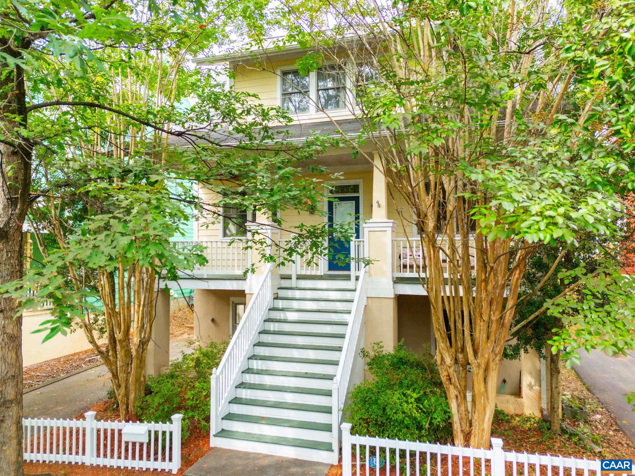 Tucked away just off Rose Hill Drive, this 3-bedroom, 3.5-bath home offers the best of city living with an uncommon sense of privacy. A 30-foot covered front porch sets the tone for outdoor relaxation, while the expansive back deck, featuring both covered and open areas, creates space for gathering, grilling, or simply unwinding in the fresh air. Inside, the main level is open and welcoming, with a beautifully renovated kitchen. Upstairs, you’ll find 3 spacious bedrooms with generous storage. The finished basement extends your options with a large rec room, a full bath, and potential to add a fourth bedroom if desired. This is a rare find in Charlottesville: a private city retreat with flexible living space both inside and out.