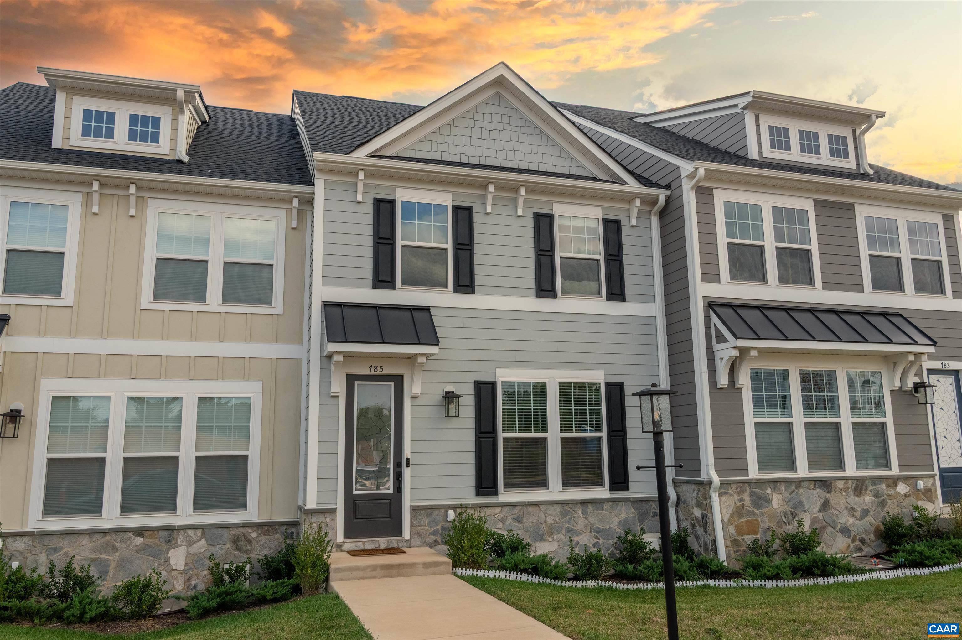 New construction without the wait! This virtually-new, move-in ready townhome, built by Greenwood Homes, offers a scenic setting with Blue Ridge Mountain views, parks, and walking trails just minutes from downtown Crozet and Western Albemarle Schools. This eco-friendly, low-maintenance farmhouse-style home offers two stories plus a basement with a rec room—ideal for an office, playroom, or gym—and a rear-entry 2-car garage. The main level boasts hardwood flooring throughout the main areas and an open layout with a spacious modern kitchen, oversized granite island, white cabinets, walk-in pantry, and stainless steel appliances. Upstairs, you'll find the spacious primary suite, two additional bedrooms, a full hall bath, & a convenient laundry area. Features include dual vanities, a frameless glass shower, oak stairs, solid core doors, wood shelving, upgraded trim, spacious back deck and an energy-efficient furnace. Enjoy easy access to Crozet Park via a walking path and direct community access to downtown Crozet. A short drive to I-64 & 250 Access, 25 minutes to Downtown Charlottesville and UVA. The Glenbrook community offers green spaces, tot lots and community firepits, providing ample opportunities to stay active and connected!