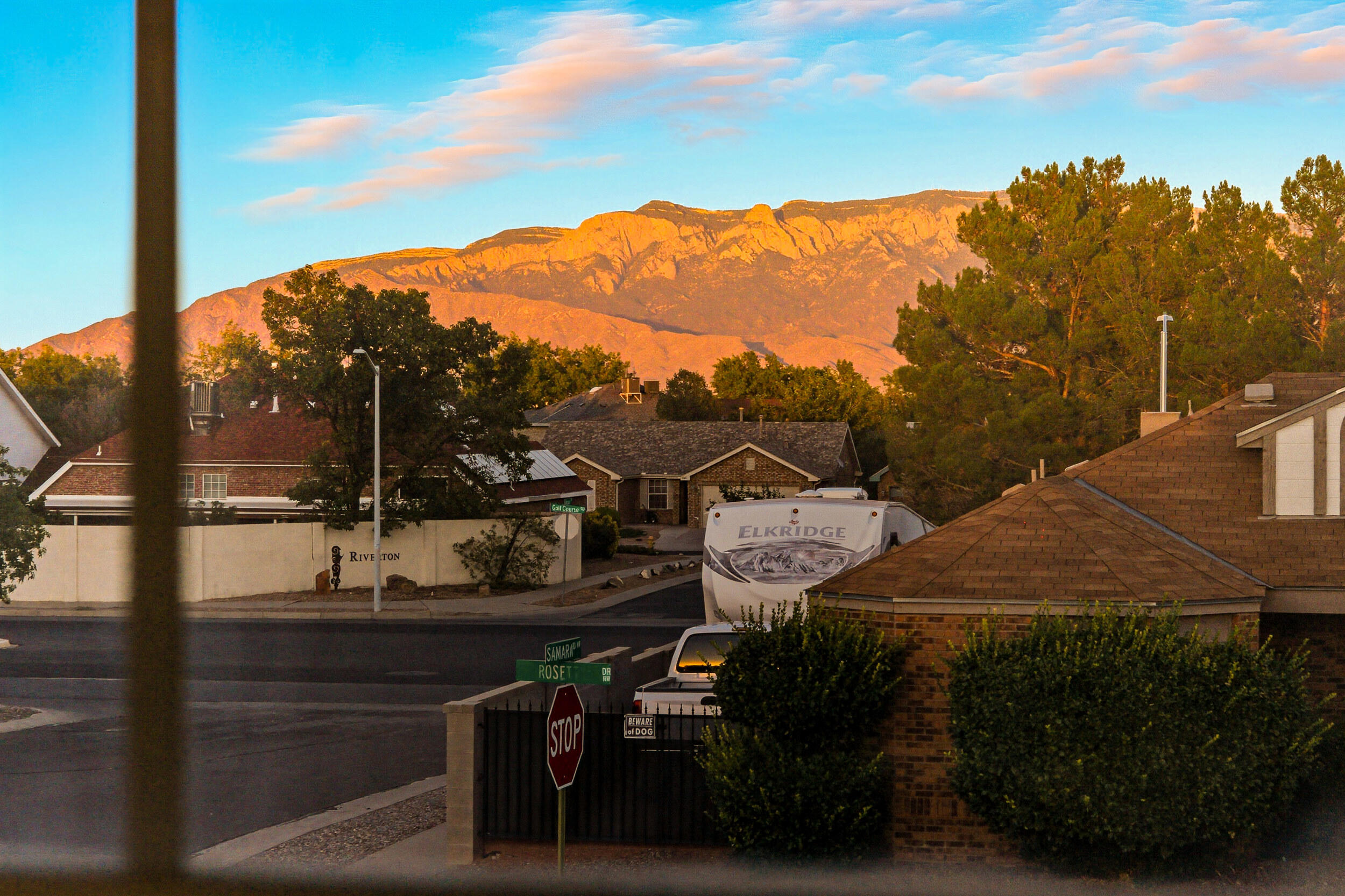 Welcome to this beautifully kept 3-bedroom, 2.5-bath home, perfectly situated on a desirable corner lot. Former Gilligan model home, showcasing quality features and added confort including a finished garage with heating and cooling. Backyard access thru wrought iron gates with an RV pad, for extra parking/recreational needs. Relax and take in the Sandia Mountain views from the covered patio or the private balcony off the primary suite. Primary bedroom also features a soaking tub to unwind after a long day. Inside, you'll find generous room sizes in every living space, offering comfort and functionality. Kitchen provides ample counter space and abundant storage, making it a dream for cooking and entertaining. This home blends convenience, charm, and views--ready for the next owner to enjoy!