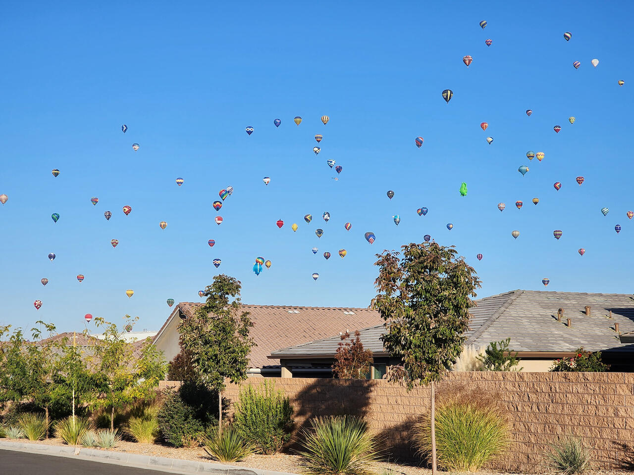 Open House Saturday 9/27 2 pm to 4 pm * Spacious Pulte Home In Gated NE Heights Neighborhood Has Room For Everything! * Three Living Areas and Six True Bedrooms Means Room for Home Offices, Guest Bedrooms, Play Rooms, TV Rooms and More * Contemporary Design with Open Floor Plan, High Ceilings, and Modern Finishes * Seller Owned Solar System with Whole House Battery Back Up and Car Charger * Kitchen Features Island with Waterfall Countertop, Induction Cook-Top with Vent Hood, Wall Oven and Microwave, Built-In Stand Mixer Holder, Pull-Outs for Pots and Pans, and a Corner Pantry * Primary on the Main Floor with Luxurious Shower and Container Store Outfitted Walk-In Closet * Built-In Home Office Off Kitchen * Mountain Views From the Second Story Deck * Refrigerated AC * Covered Back Patio