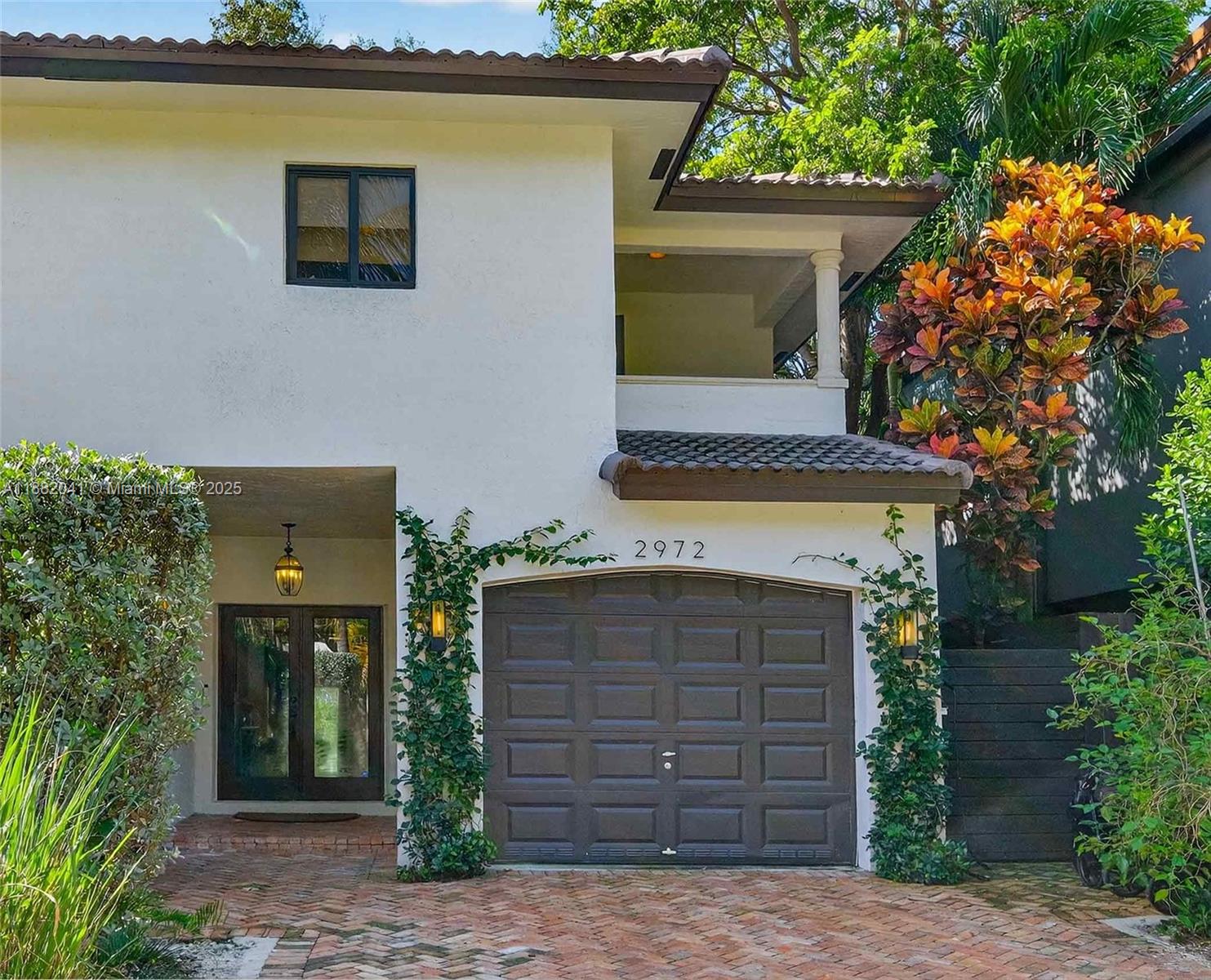 Experience refined Coconut Grove living in this stylish 3-BR, 2.5-BA townhome perfectly situated on a tranquil street close to the heart of the Grove. Light-filled interiors showcase tiled flooring throughout the spacious main level, opening seamlessly to a private fenced patio with built-in barbecue, an inviting space for al-fresco dining and entertaining. Impact windows and filtered water system throughout.  Surrounded by other luxury townhomes, this residence offers a true sense of community while keeping you within strolling distance of Coconut Grove’s vibrant boutiques and fine dining. A playground and dog park sit on the neighboring block - ideal for modern living. This home fosters a blend of sophistication, ease, and connection in one of Miami’s most sought-after neighborhoods.
