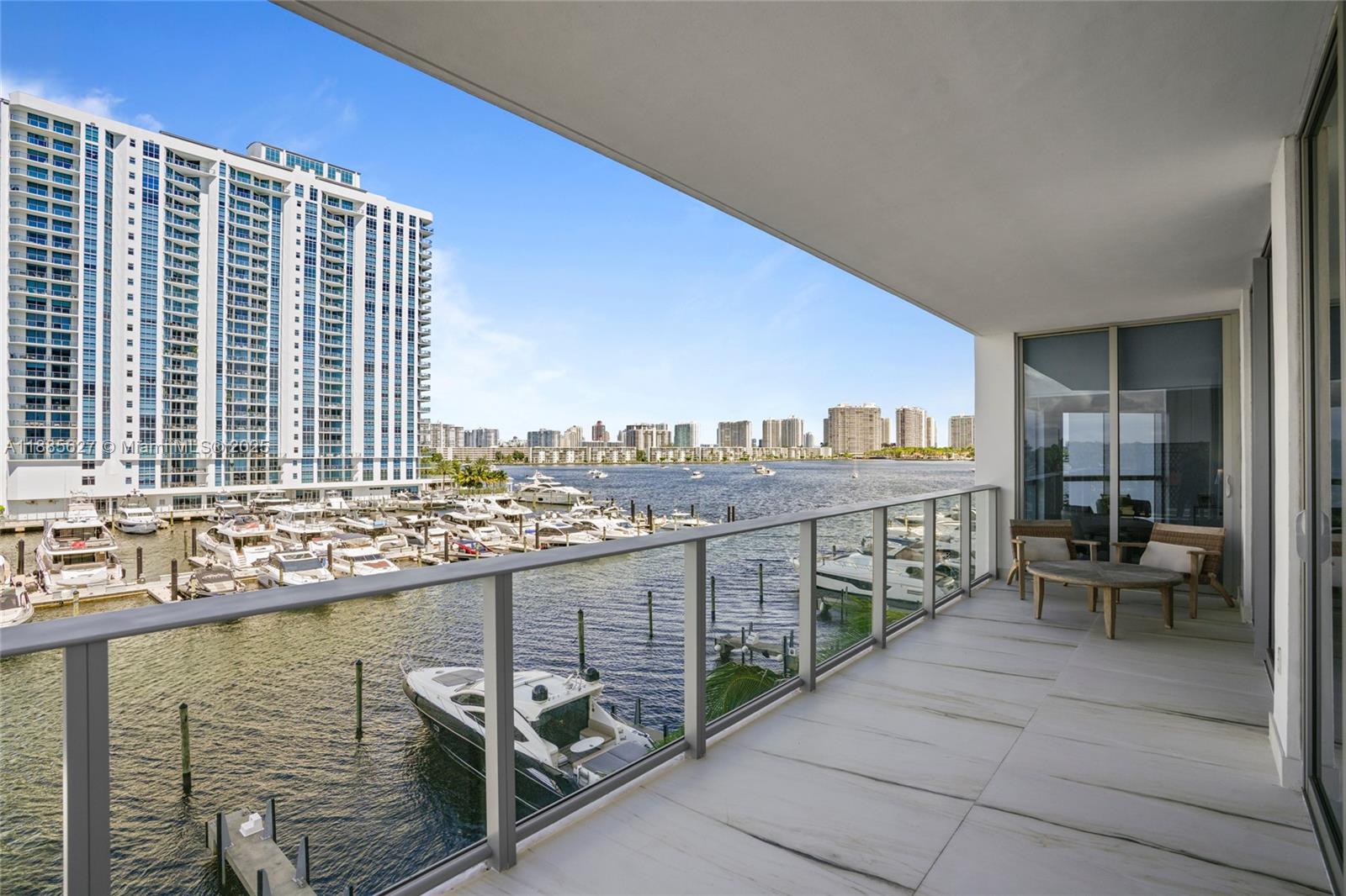Experience elevated waterfront living in this expansive 2-bedroom + den, 2.5-bathroom residence at the prestigious Reserve at Marina Palms. This corner unit offers a seamless blend of sophistication, comfort, and breathtaking direct water views of the Intracoastal and Marina. Spacious open layout, floor-to-ceiling glass doors, and a versatile den perfect as a home office, media room, or guest space. The gourmet kitchen features Italian cabinetry, premium appliances, and sleek finishes, ideal for both everyday living and entertaining. Private balcony access. Enjoying world-class amenities: Elegant club room with billiards, bar, and TV lounge, News café, fitness center with sauna, steam room, teen lounge, children’s play center, kids pool, Private marina with full-service slips up to 112'