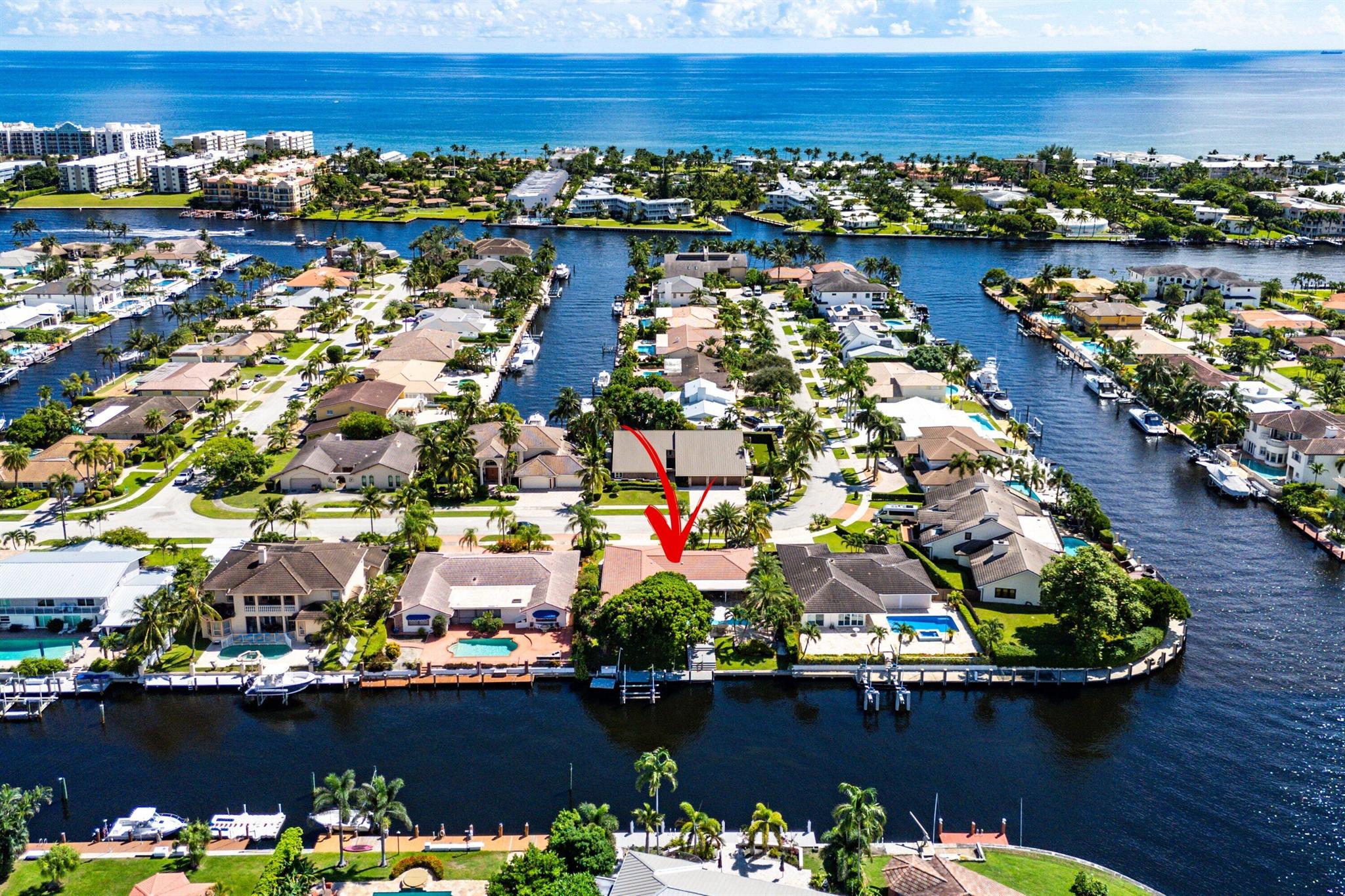 Welcome to 1219 SE 15th Avenue, a modern waterfront retreat in the heart of Deerfield Beach's coveted Cove neighborhood. With 90' of frontage and no HOA, you'll enjoy the ease of waterfront living on this oversized 10,600+ sf lot without restrictions. Bring your boat! Entertain freely, and make this home truly your own. Three spacious bedrooms plus a private office provide plenty of room to spread out, while the central kitchen featuring gas range and premium appliances makes cooking a centerpiece of the home.The backyard is a true highlight--an expansive covered patio, heated 30ft pool, and wide canal views create a resort-style setting. With 90 feet of deepwater frontage, a 20K lbs. boat lift, floating dock, and direct access to the Intracoastal, this property is a boater's dream.