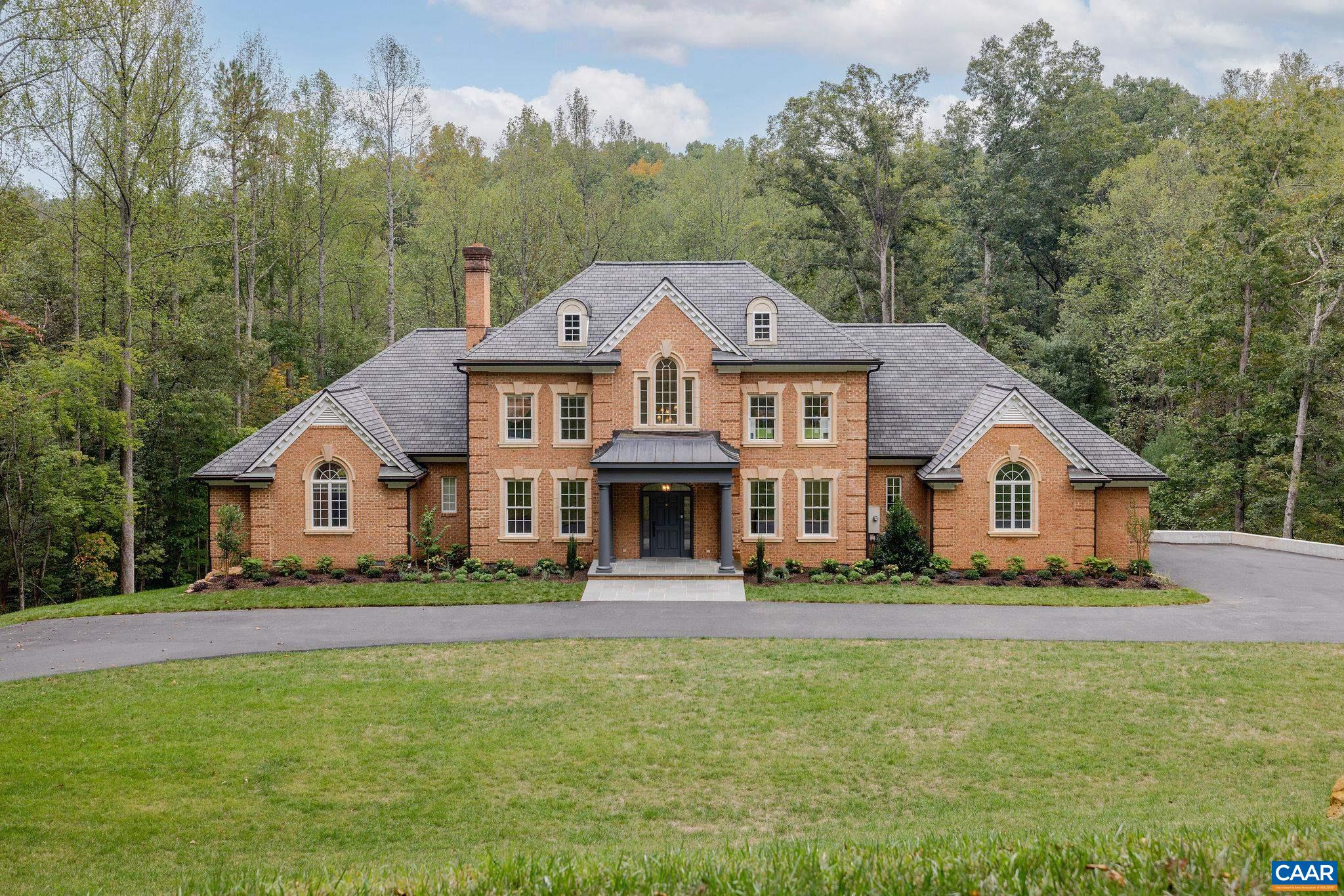 Tucked away on over 9 private, picturesque acres is this distinguished Waverly home. The original developer reserved this parcel for himself and it is arguably the finest in the neighborhood, complimented by a remarkably distinctive 4 bed/3.5 bath house. Take in the views and sounds of Rocky Run Creek and the manicured woods around it yet also enjoy the benefits of a neighborhood in the Ivy School District. The current owners spent over $400K creating level, open lawns in front and behind the home and upgrading systems like drainage & an encapsulated crawl space.  Please see the extensive improvements list under the documents tab. The home features soaring ceilings, extensive stone and reclaimed wood detailing, a large gourmet kitchen, 1st floor primary with huge bath and private deck overlooking the views.  Abundant storage and room to expand in the easily accessed attic & unfinished basement (w/ rough-in for a bath).  Truly a RARE find: Level, open lawns in a supremely private, yet neighborhood setting 8 minutes to Ivy Elementary School!