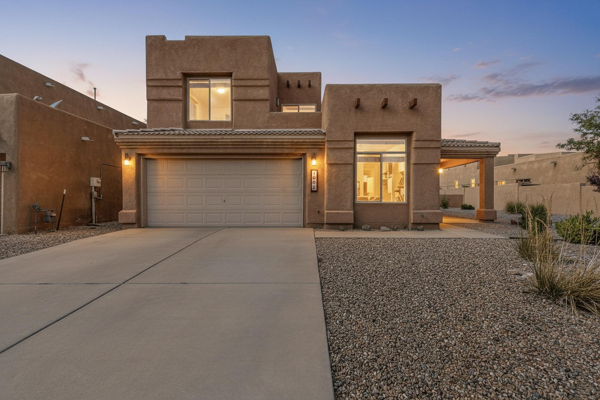 Bright and inviting, this pueblo-style home in La Sala Del Norte sits on an oversized .18-acre lot with a spacious side yard. 2015 kitchen remodel with rich cherry cabinets, soft-close dovetail drawers, Bosch gas range, 18'' dishwasher, hood, frig, and sleek Hi-Mac solid surface countertops.Drip irrigation front & back, New backyard, a 2012 HVAC combo/heat pump with AccuClean air purification system, and a 2014 BAC membrane roof. The separate owner's retreat with sitting area and private roof deck, while a versatile bonus room makes the perfect office/studio/playroom. Raised ceilings, clerestory windows, open kitchen/dining & living space w/kiva fireplace. Close to walking trails & the huge Vista Del Norte Park