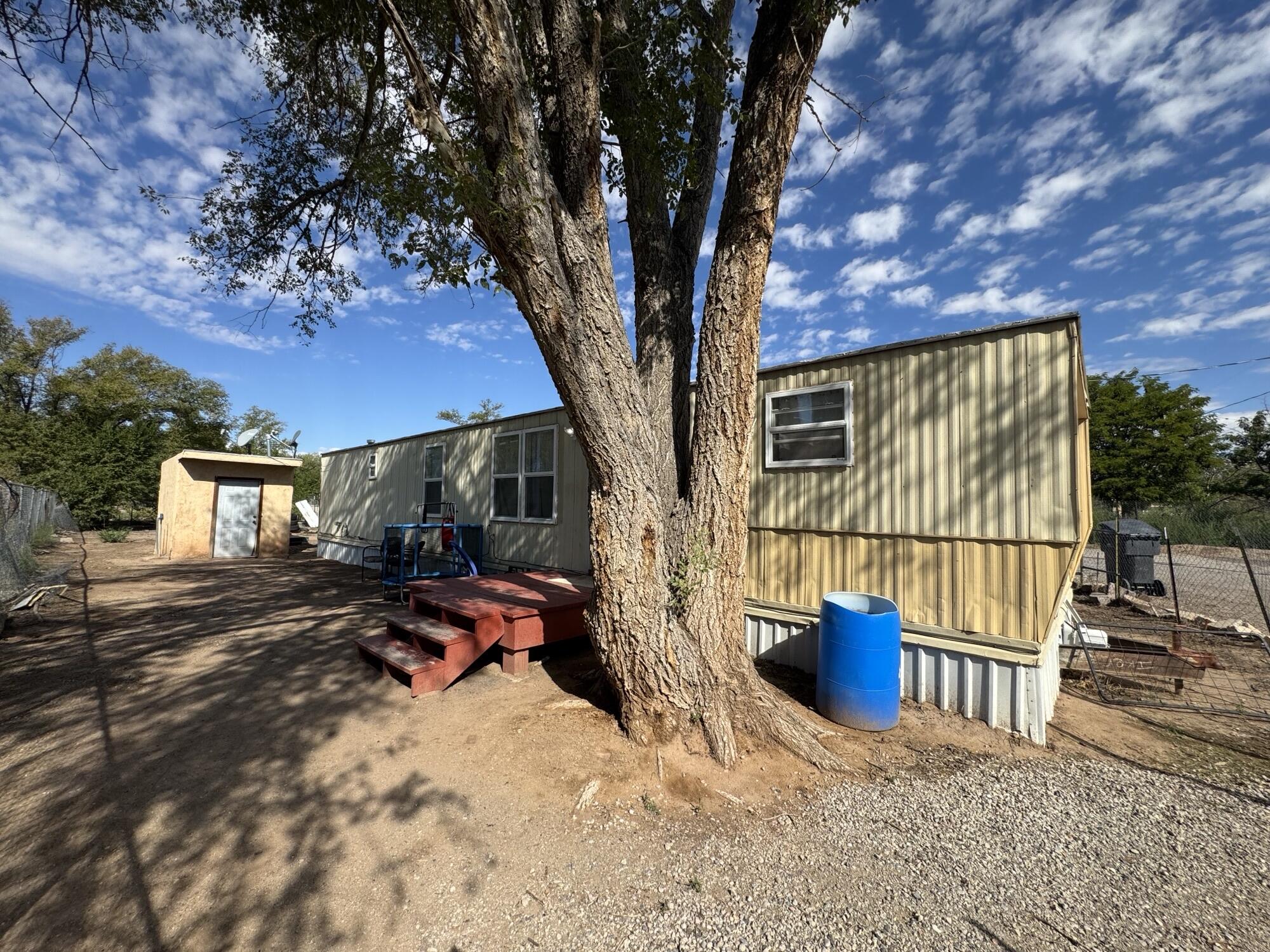 2 Bed, 1 bath single wide Trailer/Manufactured Home Plus 1.052 Acres of Land!  Well & Municipal water/sewer.  HAS OVER 5 AC/FT of Domestic OSE Water Rights!  Live in this home while you build your dream home! Seller can Build to Suit as well.